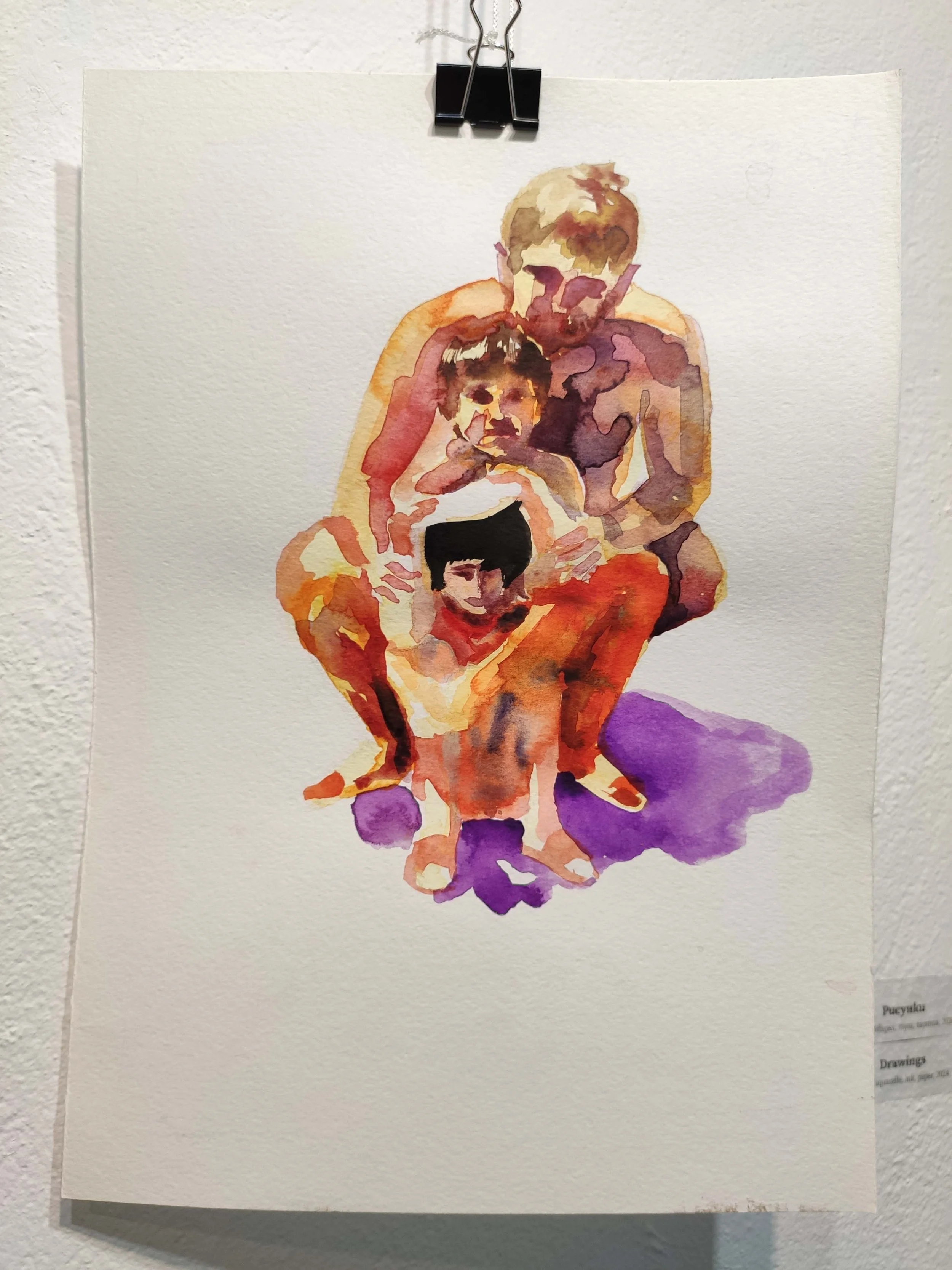 Watercolor painting of a family of four, sitting together. An adult male is seated with three children around him, all smiling. The painting uses warm tones with purple shadows.