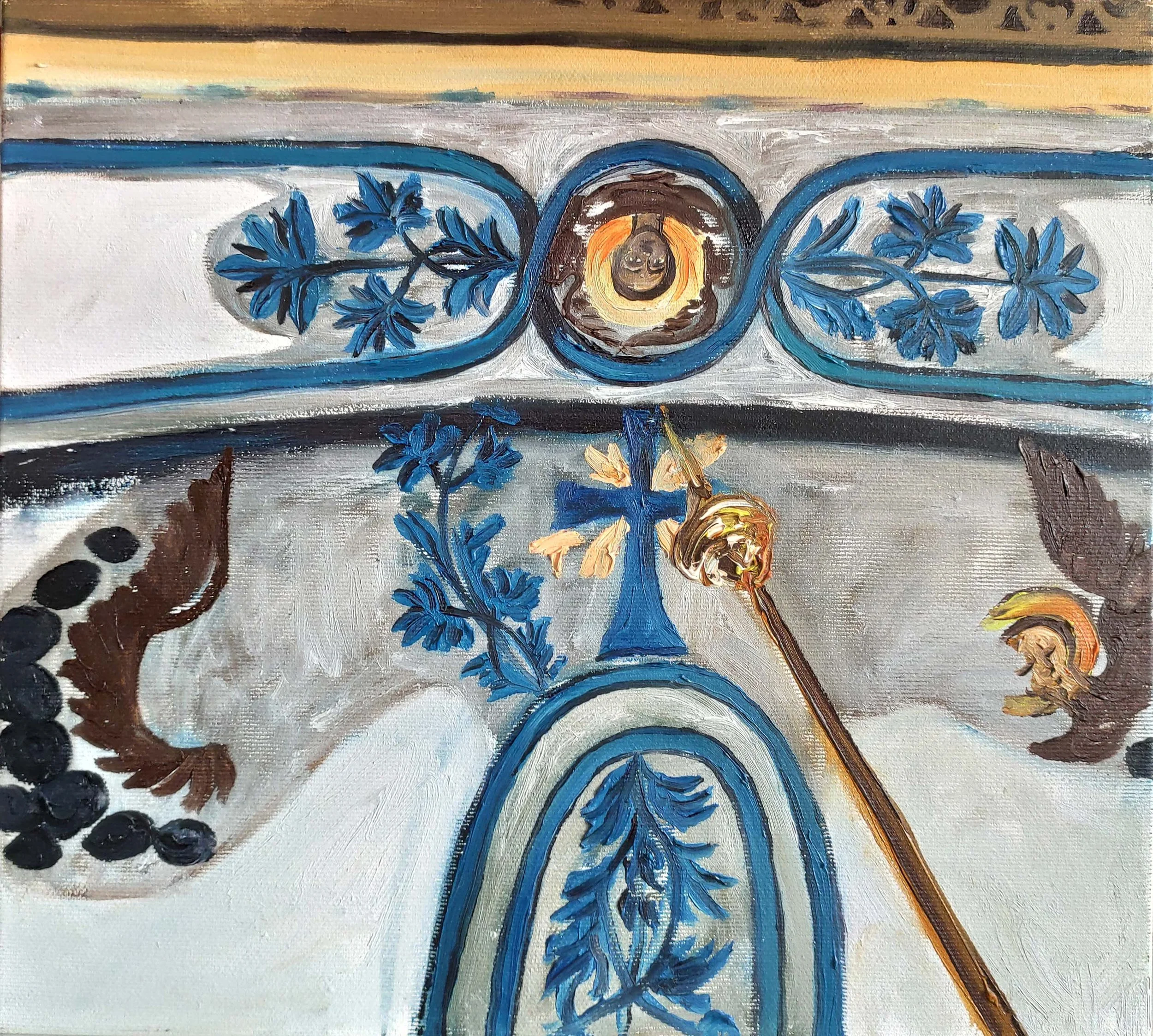 A painting featuring blue floral and leaf motifs, a gold and black spoon, and a circular element with a human face at the center, in a decorative style.