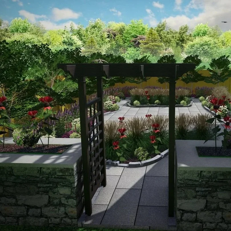 A garden scene with a black wooden trellis archway leading to a paved walkway, surrounded by various colorful flowers and lush green trees in the background under a partly cloudy sky.