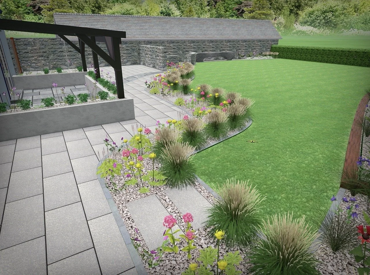 A landscaped backyard with a patio area, flower beds, a lawn, and a stone wall background.
