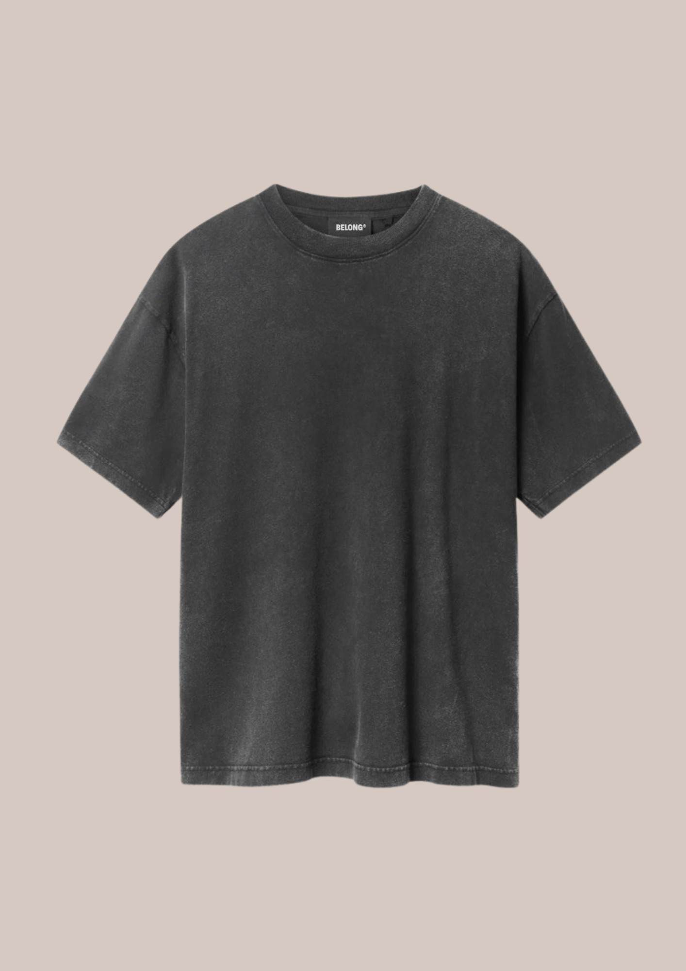 A black T-shirt with a faded, vintage look hanging against a plain beige background.