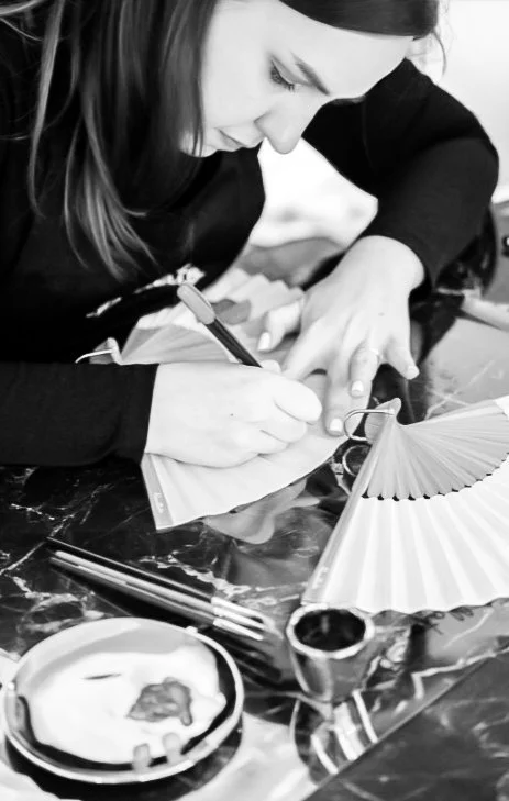 Linda Röhrich working on a hand-painted commission at her studio
