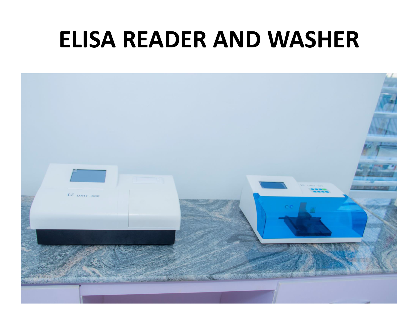 ELISA reader and washer laboratory equipment placed on a marble surface against a white wall.