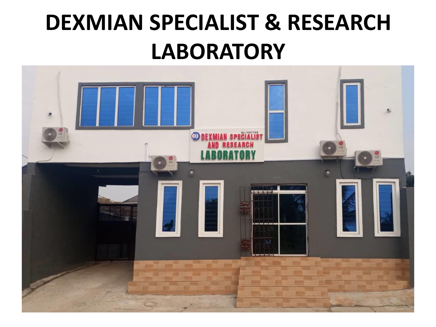 A two-story building labeled 'Dexmian Specialist & Research Laboratory' with five red and green signs on a white background, four windows with blue glass, and multiple air conditioning units attached to the exterior.