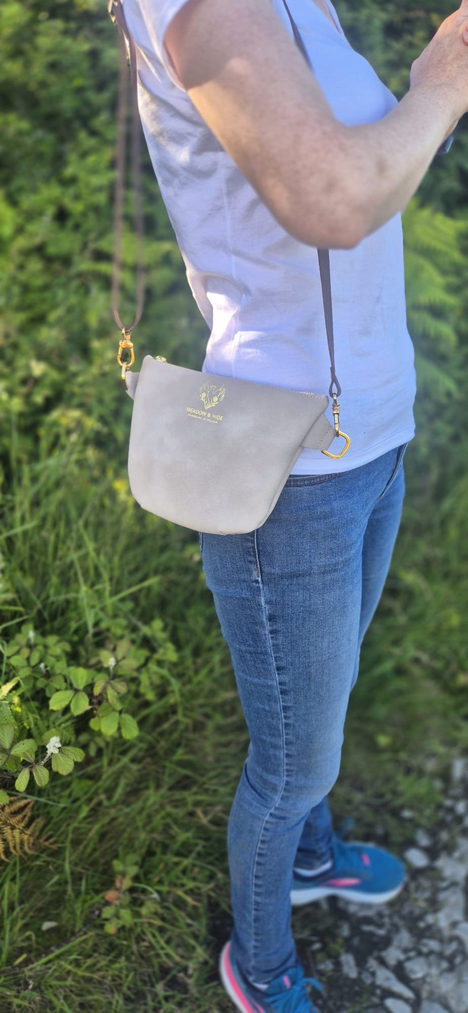 Woman wearing taupe Meadow & Hide Adventurer.jpeg