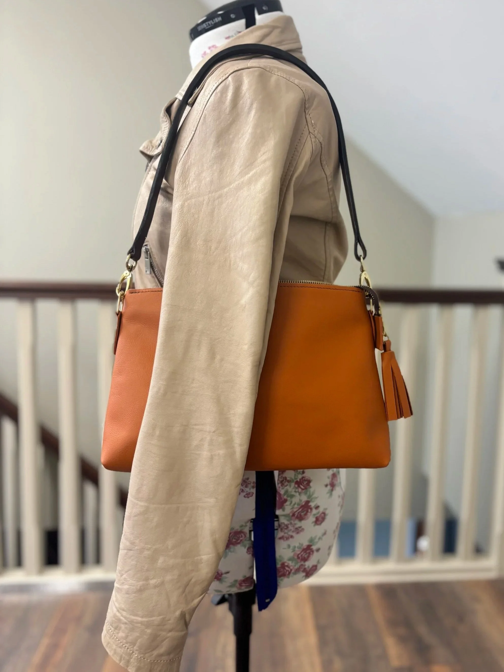 Meadow & Hide leather overshoulder bag with tassel on manequin.jpg