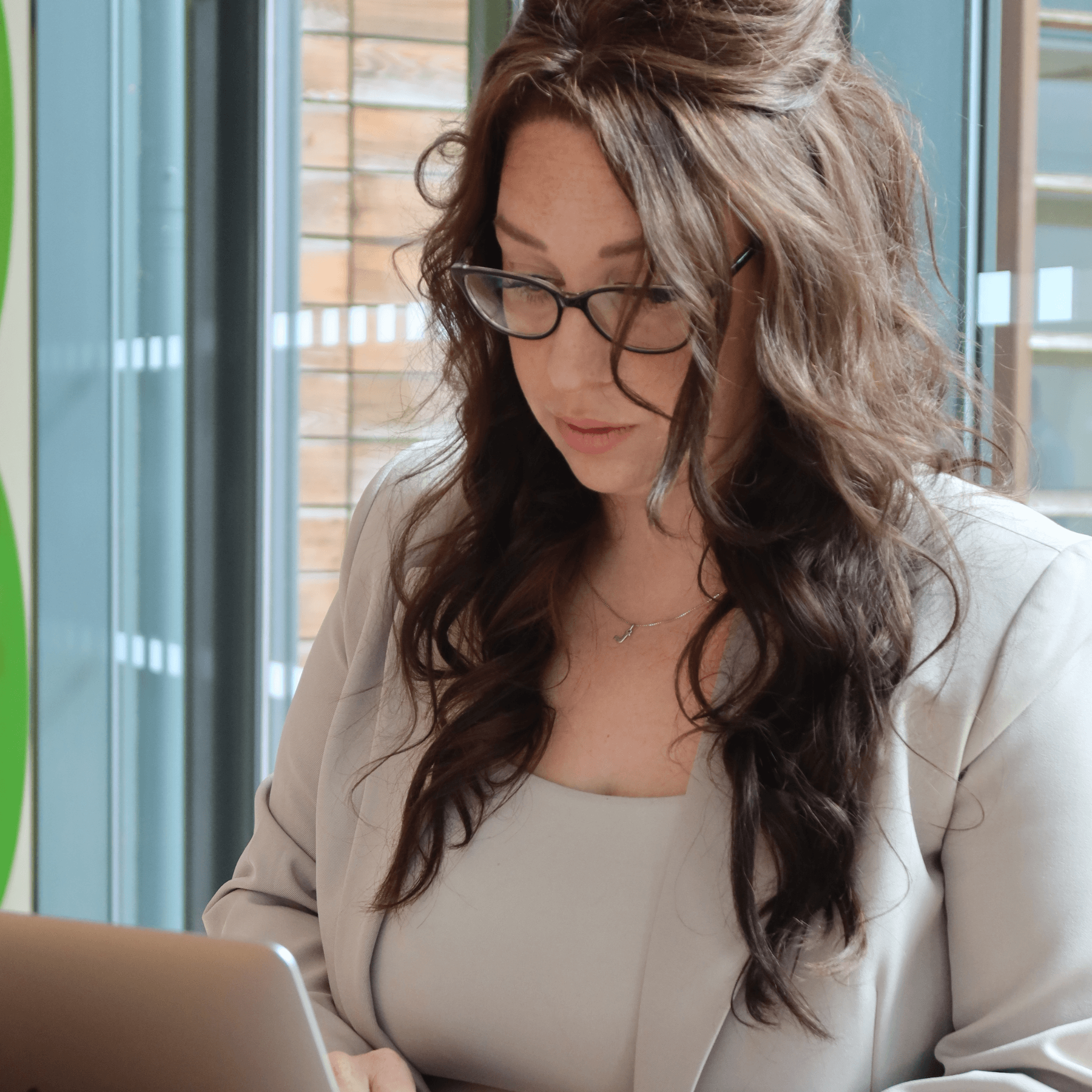 consultant reviewing SEO and AI search strategy on a laptop, helping business owners get found on Google, Claude, ChatGPT, Gemini, and Perplexity