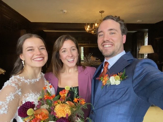 Laurie’s customers, Fernando and Kate embracing by the lake on their wedding day.