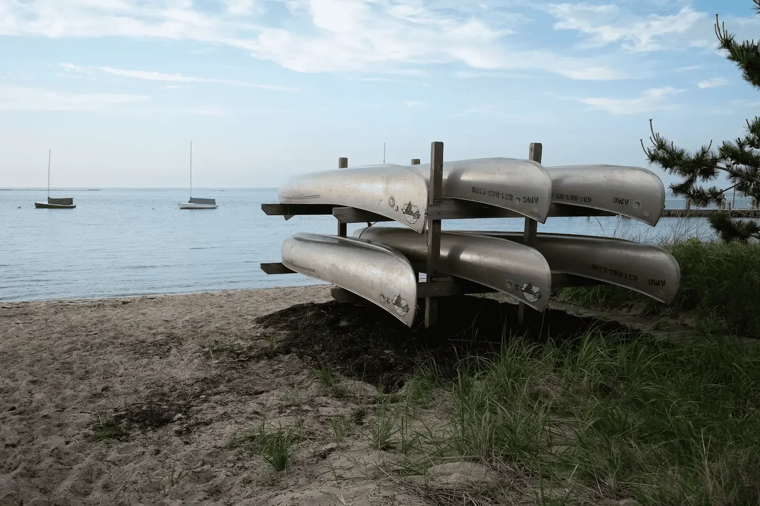 Several canoes in front of the beach