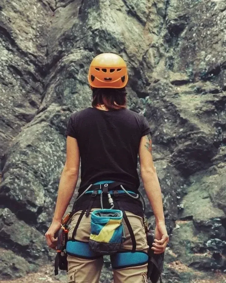 Woman geared up and ready to mountain climb