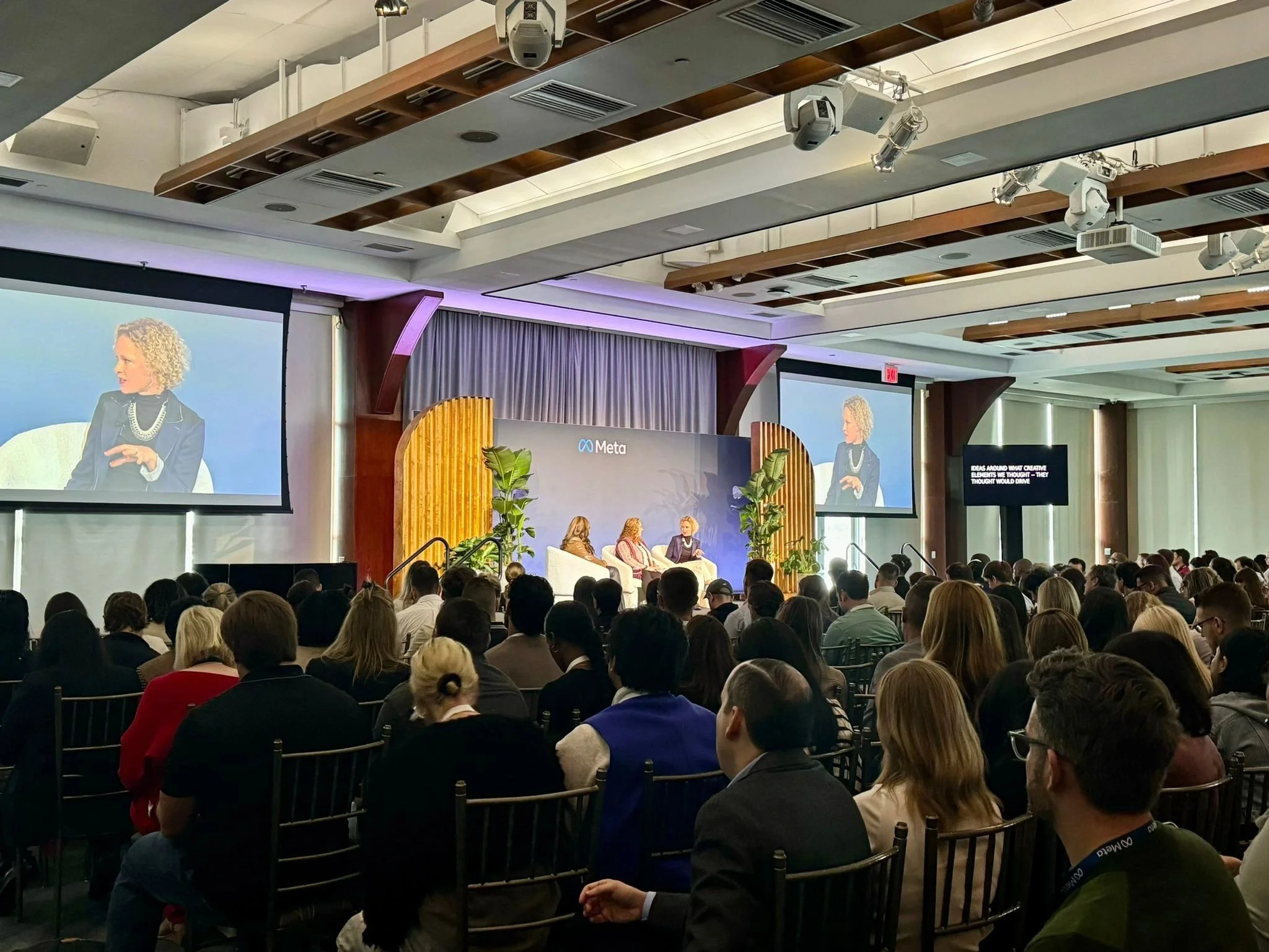 Rebecca Dykema at a Meta conference in the US speaking with Kantar