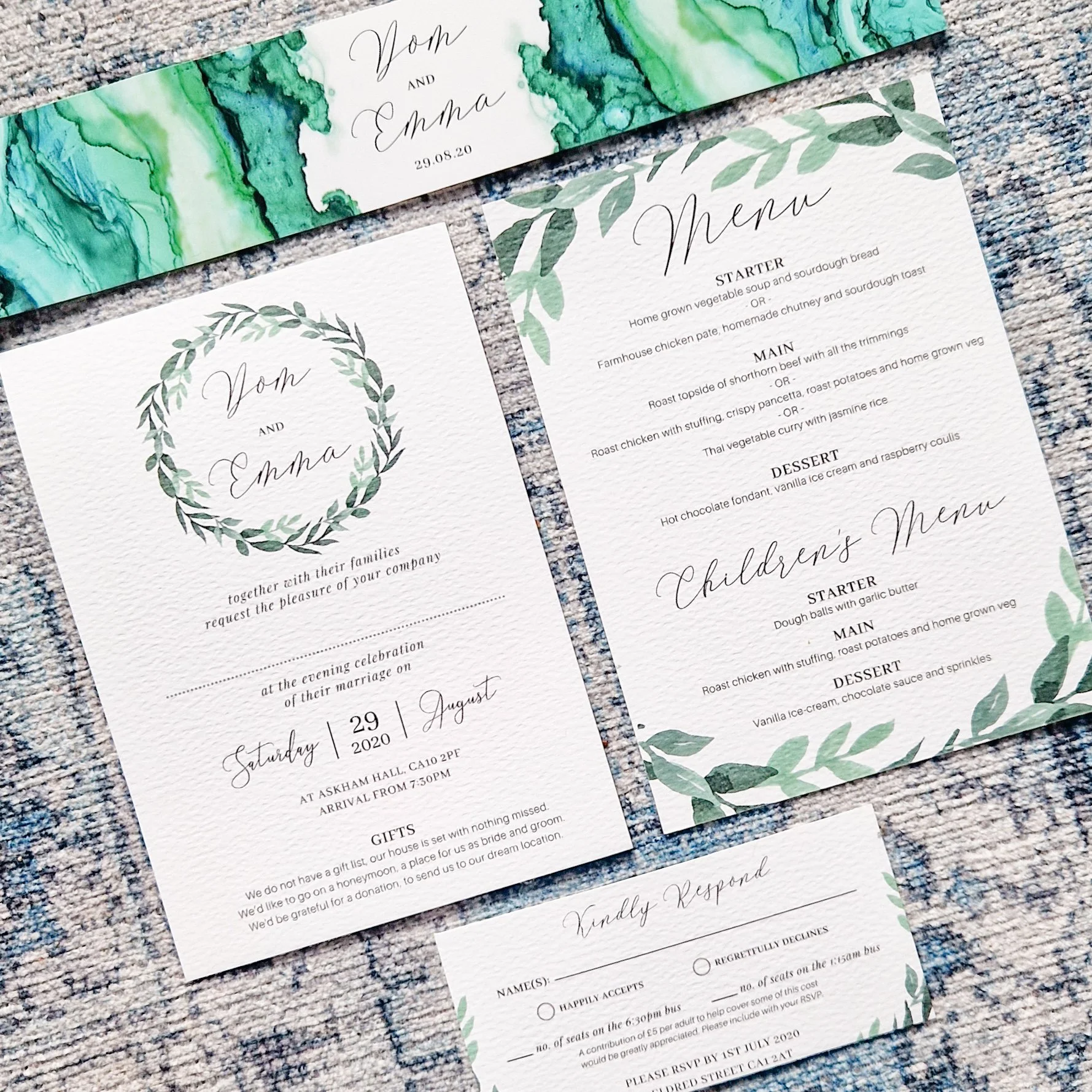 A wedding invitation set including a main invitation with green watercolor design and a eucalyptus leafy wreath, a children's menu card with green leaf border. Askham Hall Penrith Carlisle Cumbria