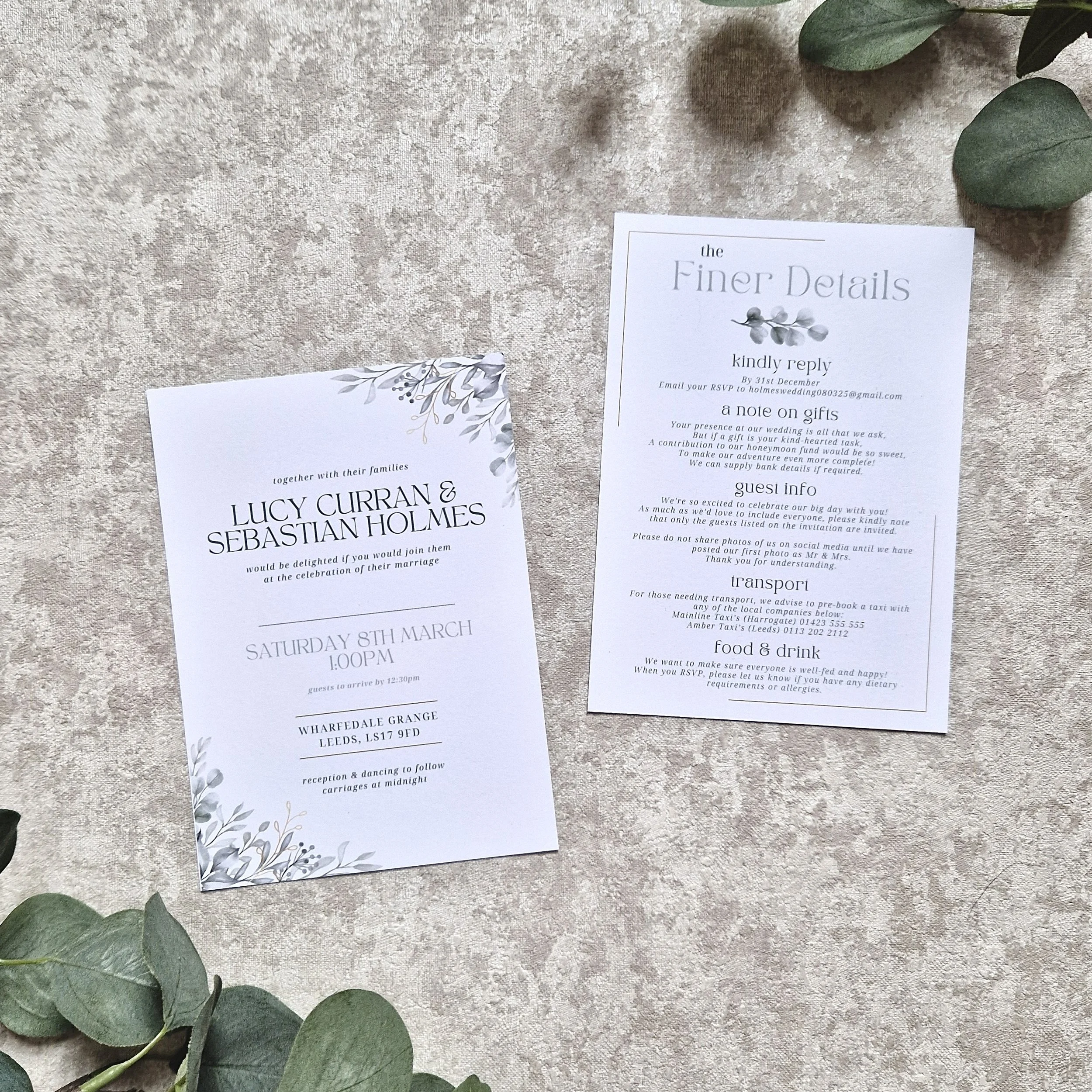 Double sided wedding invitation cards with green and gold foliage. The back of the invitation is titled "the Finer Details," providing RSVP instructions, gift note, guest info, transport, and food & drink details.