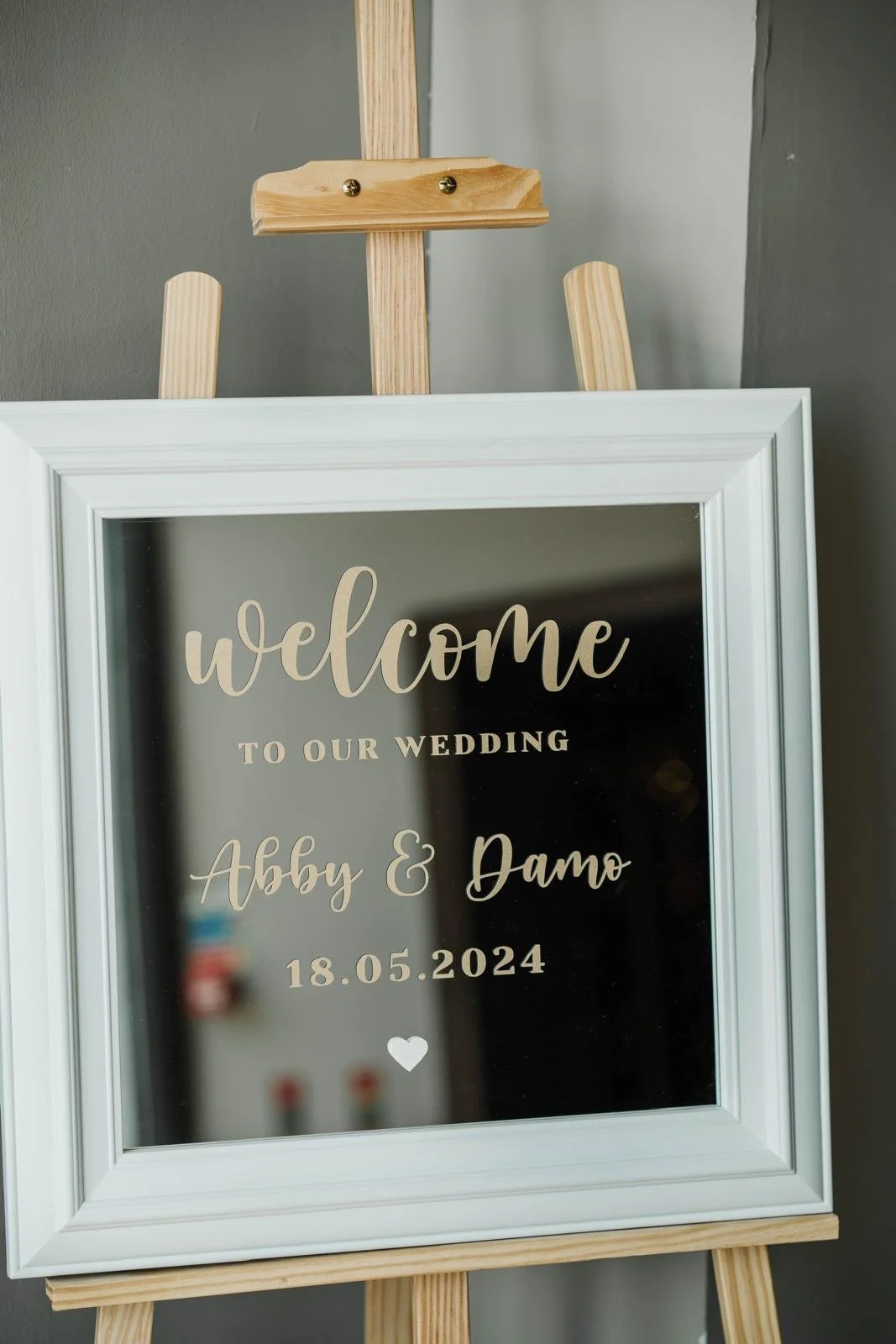 Mirror with a wedding welcome message on it, placed on an easel. Hetland Hall Scotland. 