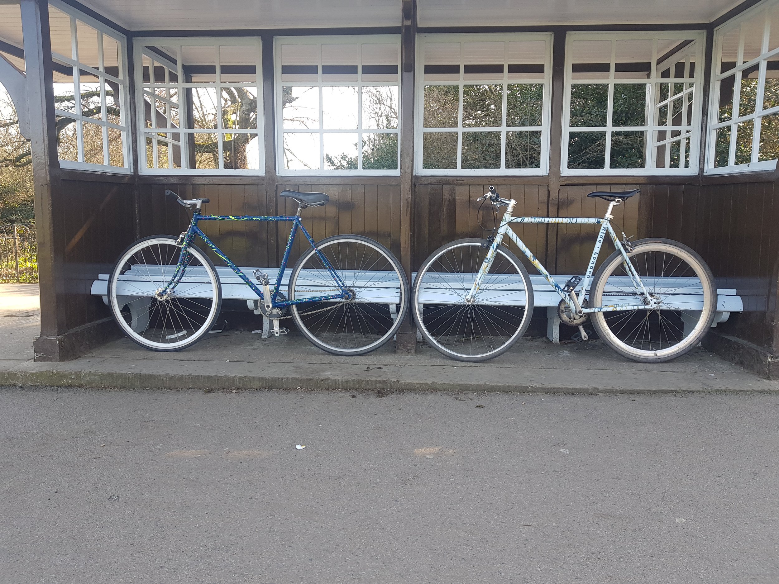 Two custom painted bikes on display in local park