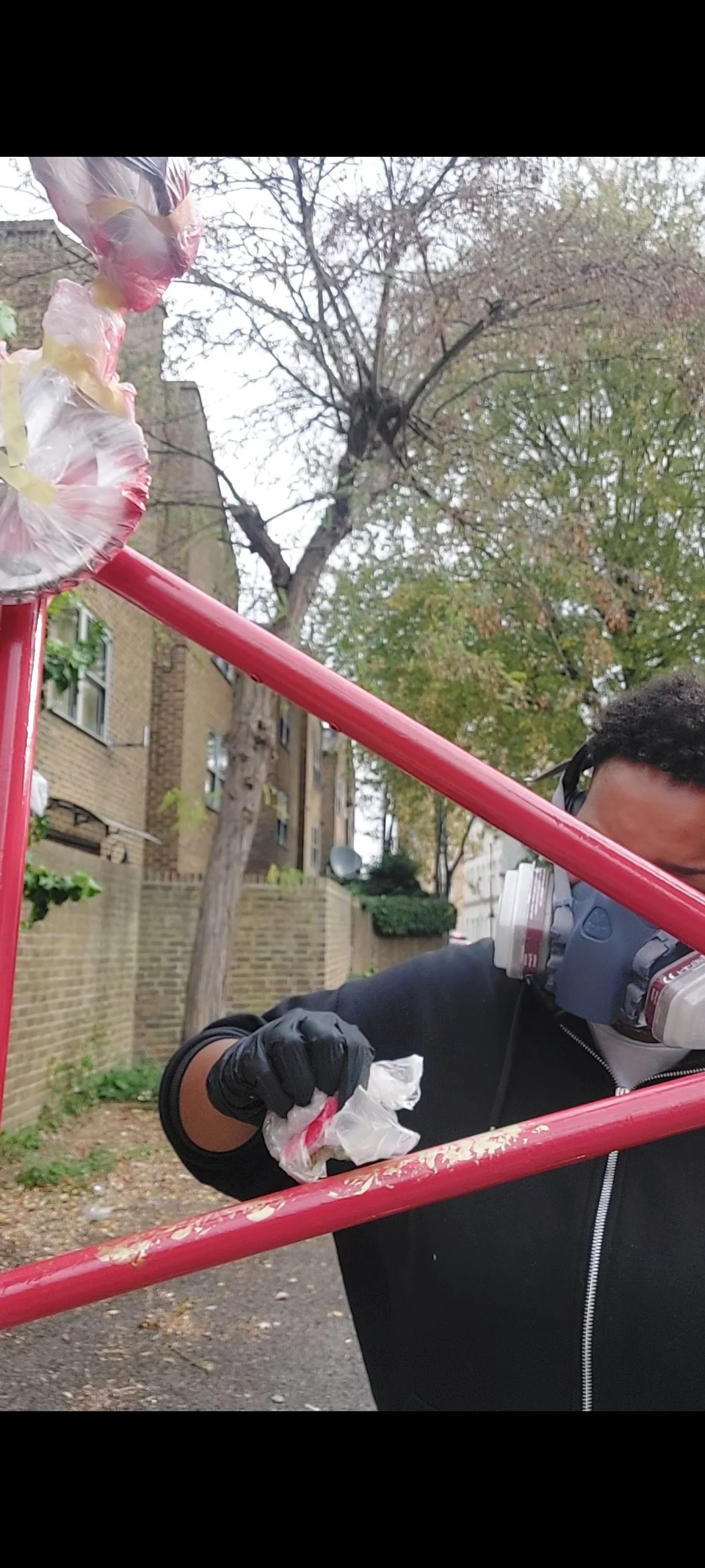 Savage using a plastic bag to add a marble affect you a bike frame