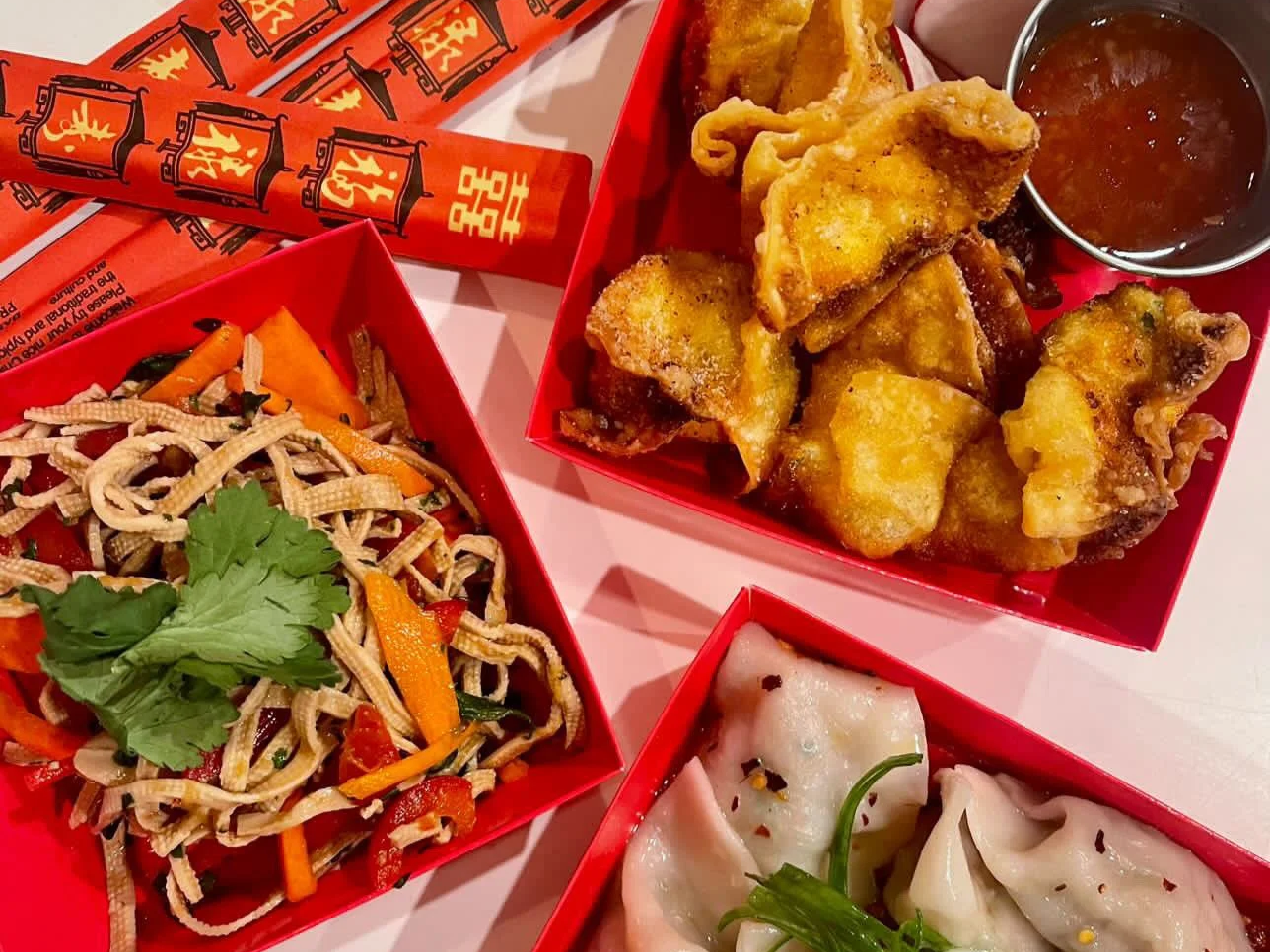dumplings, wontons, and a tofu salad from a Laowai Eats Pop-up at Cafe Lil' Treasure
