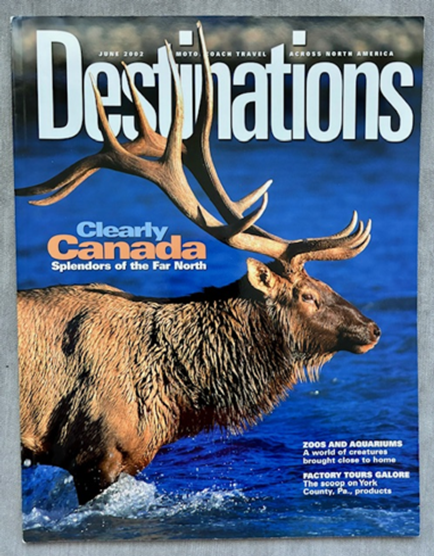 Magazine cover by Terry Parker titled 'Destinations' featuring a moose with large antlers in water, with text about Canada and travel adventures.