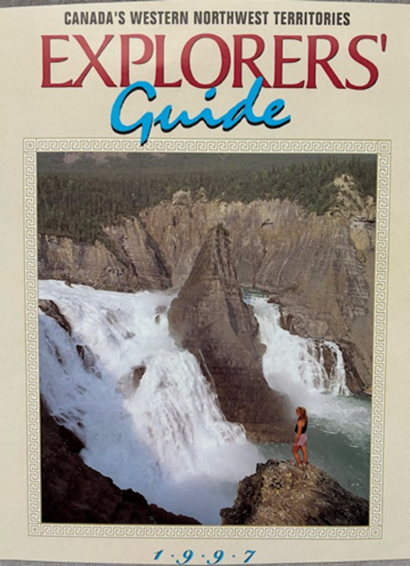 Magazine titled 'Explorers Guide' for Canada's Western Northwest Territories, with a cover photo by Terry Parker of a waterfall and a person standing on rocks near the water.