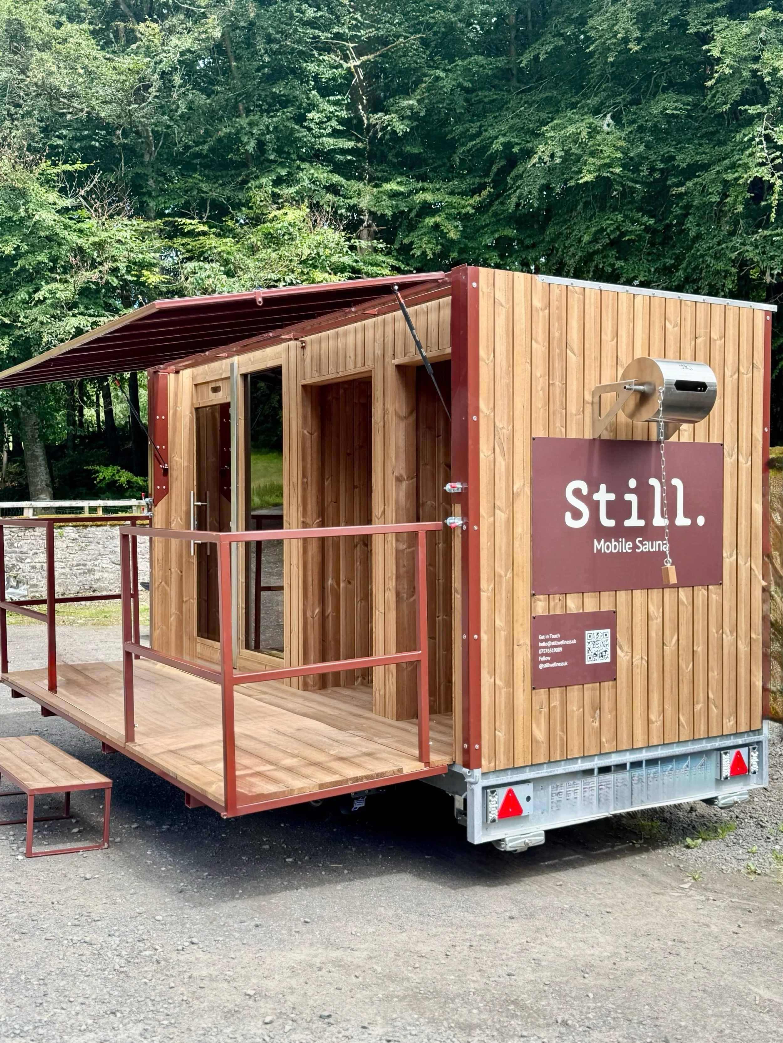 Still Wellness Sauna Trailer, Fully mobile Sauna with changing and storage facilities incorporated into design.  Sauna Trailer in Scotland for hire with front decking, canopy for all weathers and changing rooms.  Sauna Trailer Scotland