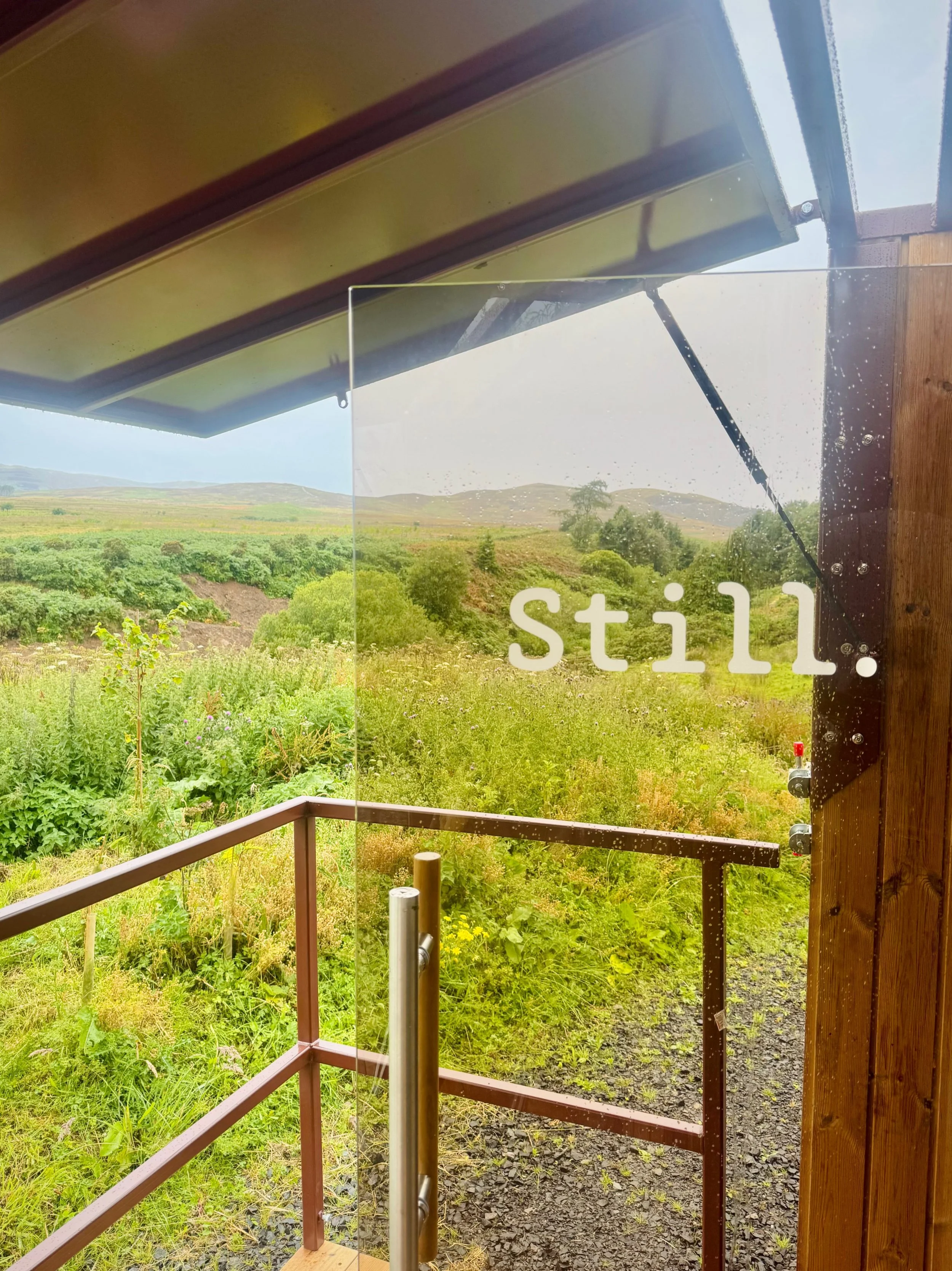 Still Wellness Mobile Sauna Scotland, Mobile Sauna Trailer to hire in Scotland, Contrast therapy Edinburgh, View from inside mobile sauna to outside scottish landscape