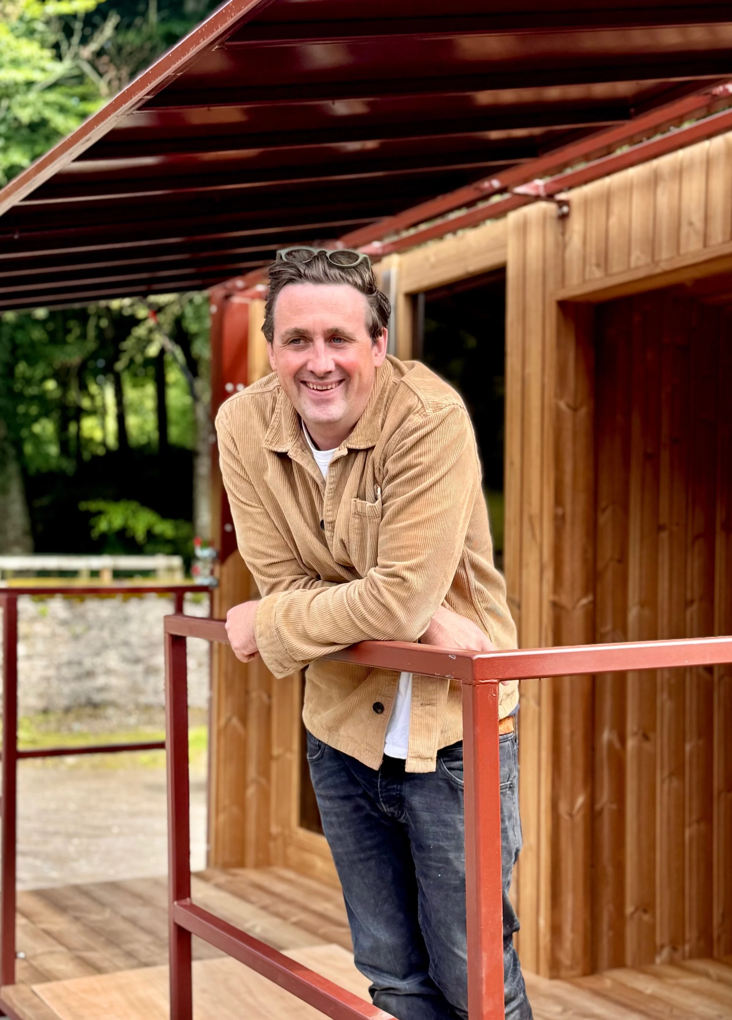 Still Wellness Sauna Design founder Colin Hart, portrait image taken on mobile Sauna trailer design in Edinburgh Scotland