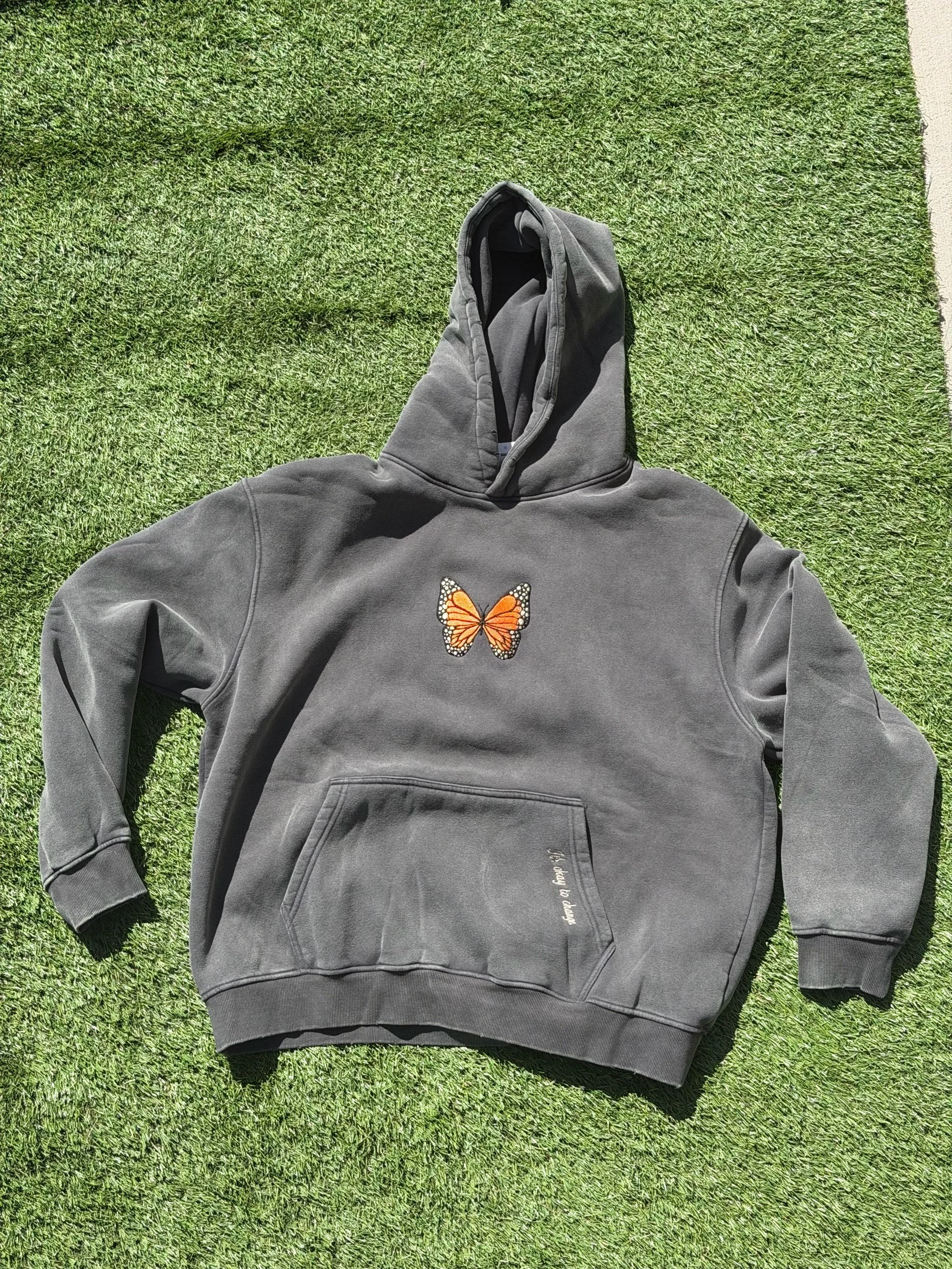 Grey hoodie with a monarch in the center