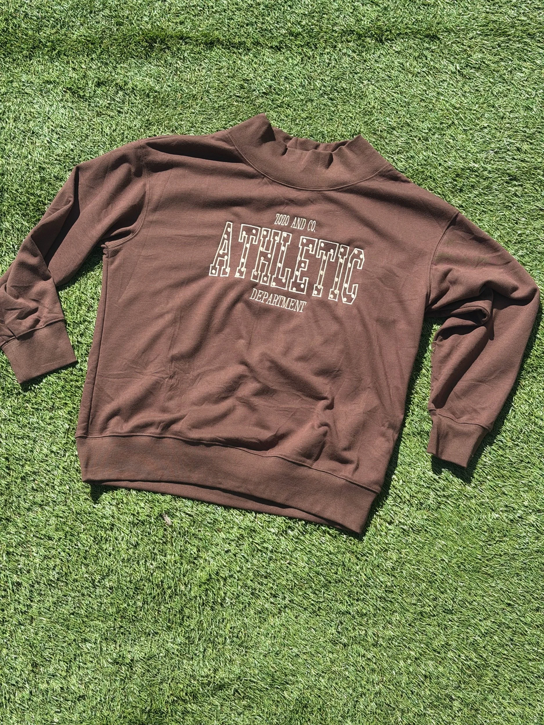 Brown mockneck with ZoZo and Co. Athletic Department across the chest.