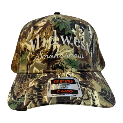 Camouflage trucker hat embroidered with the words 'Midwest Smokeshow' on the front.