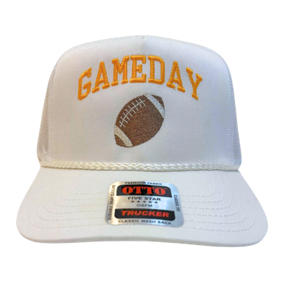 White trucker cap with gold embroidered text 'GAMEDAY' and a football graphic on the front panel.