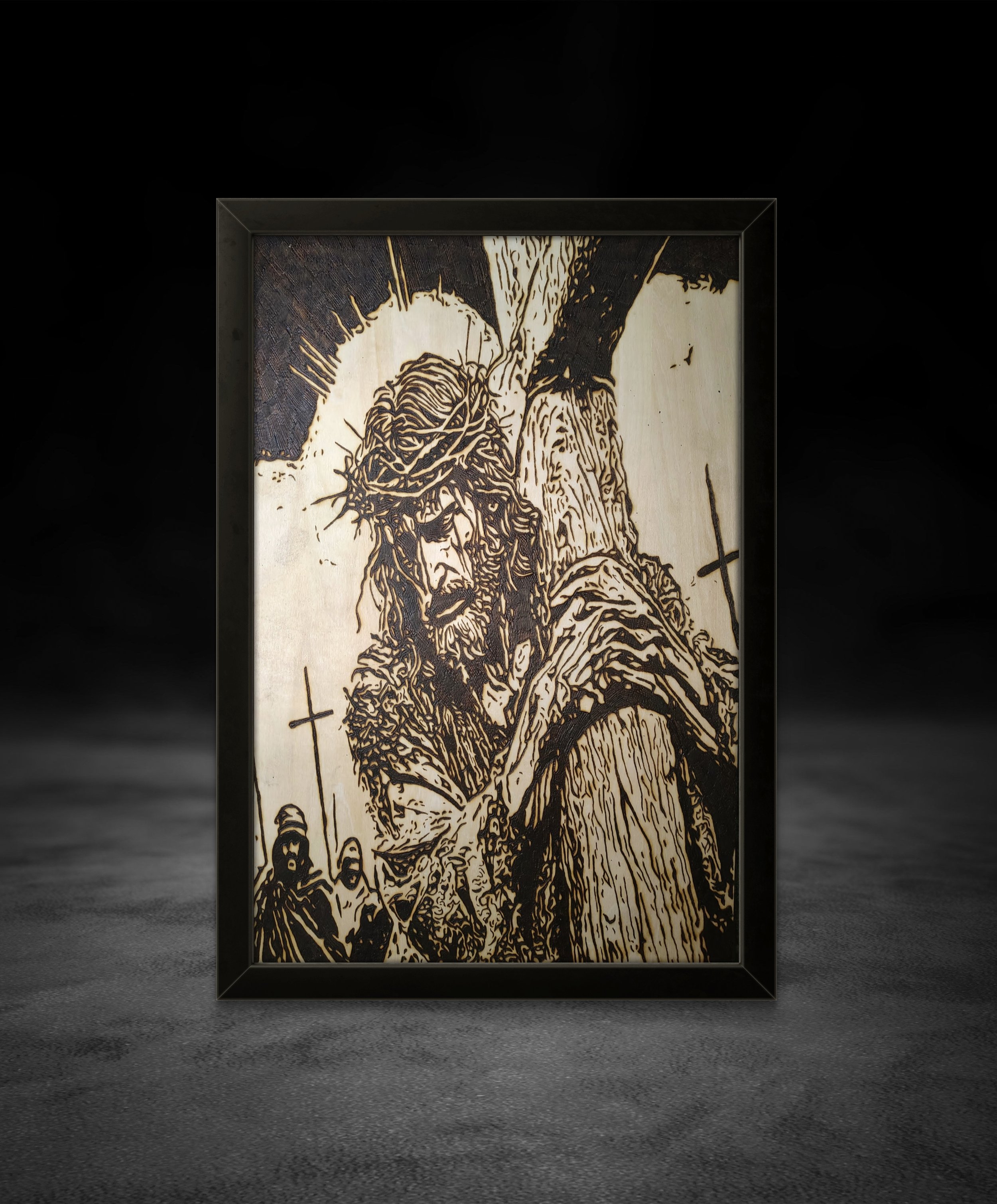 Close-up view of detailed wood-burned Christian wall art illustrating sacrifice, faith, and burden on basswood