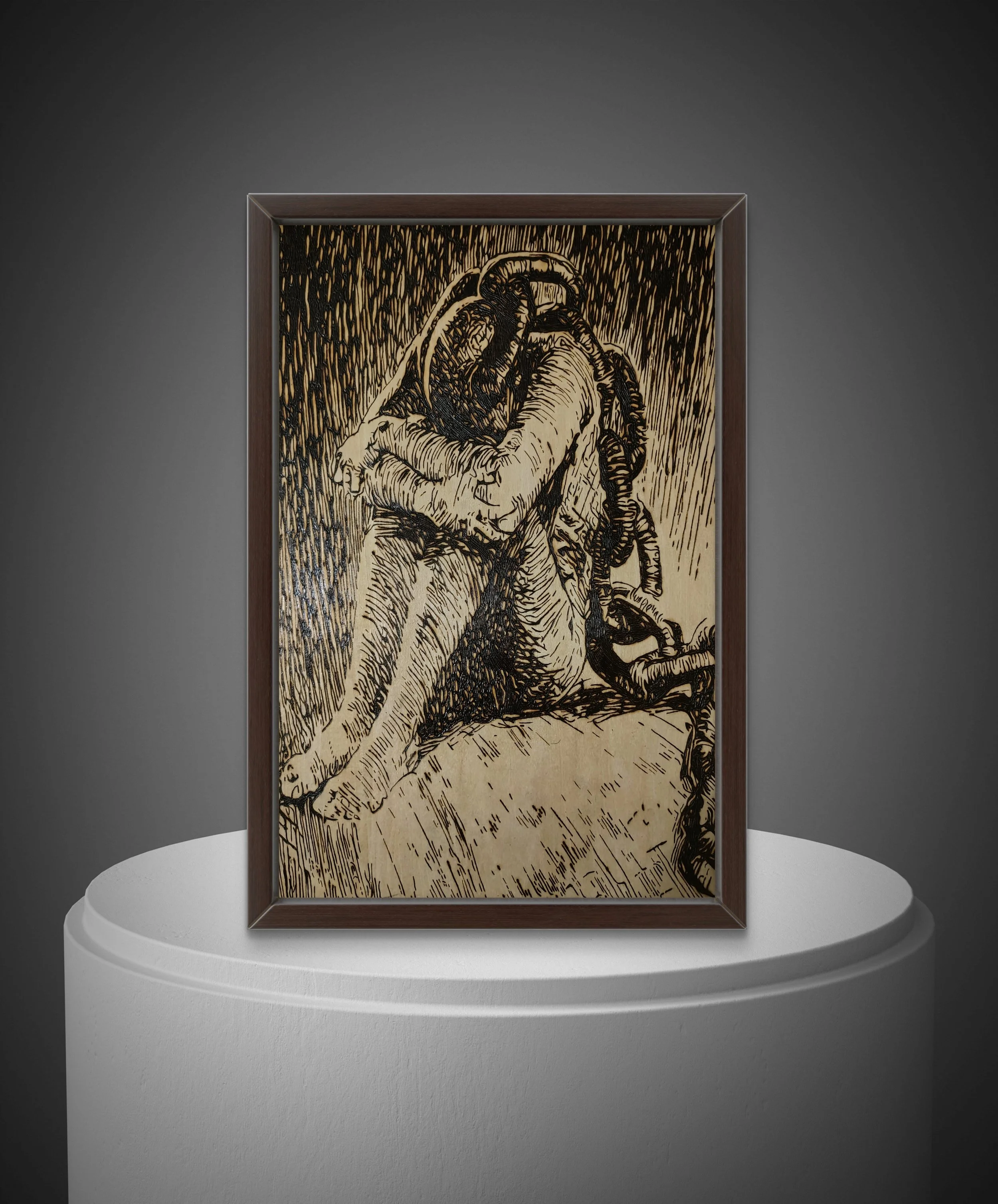 Hand-burned wood artwork titled Chains Of The Mind depicting a bound figure seated in isolation, burned into basswood and framed