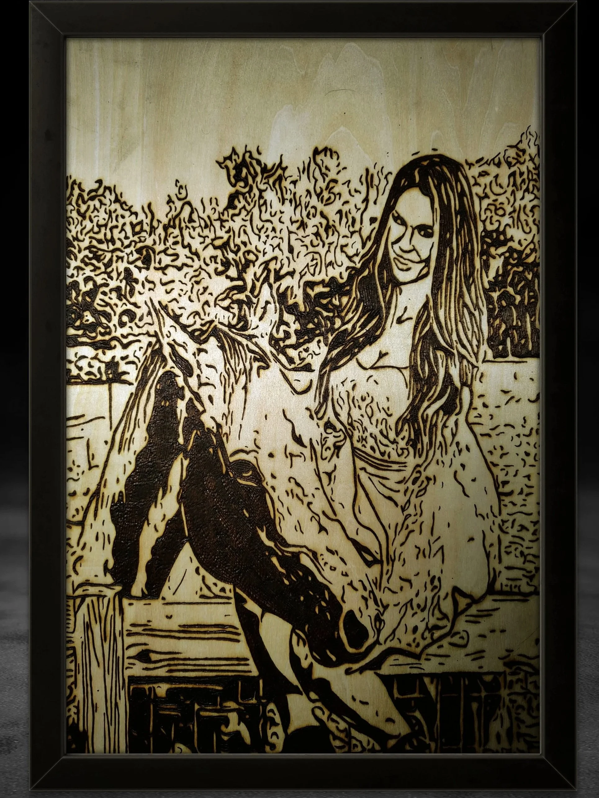 Hand-burned wood portrait of a model and influencer, Kristen Strout, standing beside a horse, capturing a serene outdoor moment through detailed pyrography on natural wood, framed as a custom handcrafted wood burning artwork