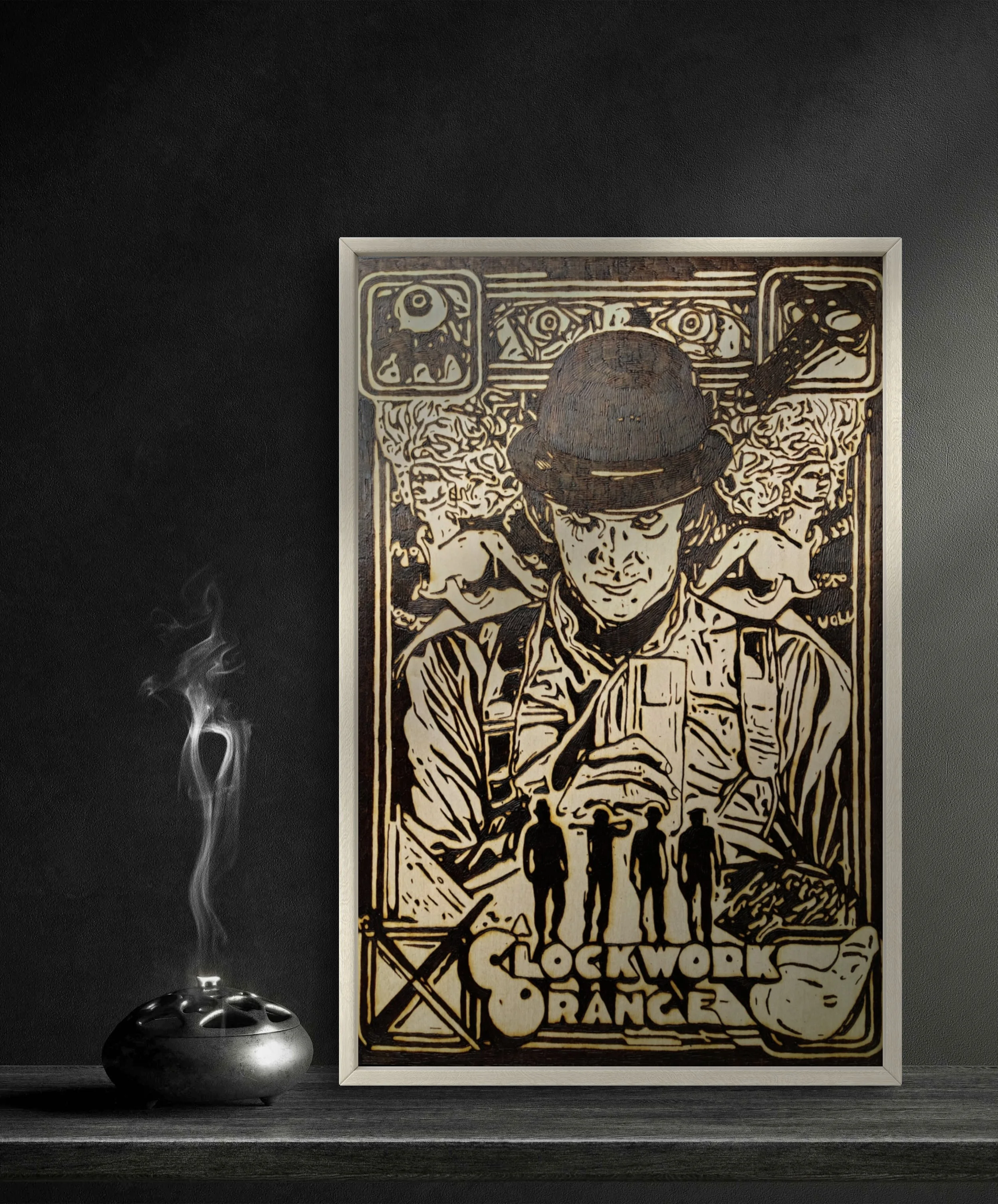 Custom wood-burning artwork inspired by A Clockwork Orange, showing a centered portrait of Alex DeLarge