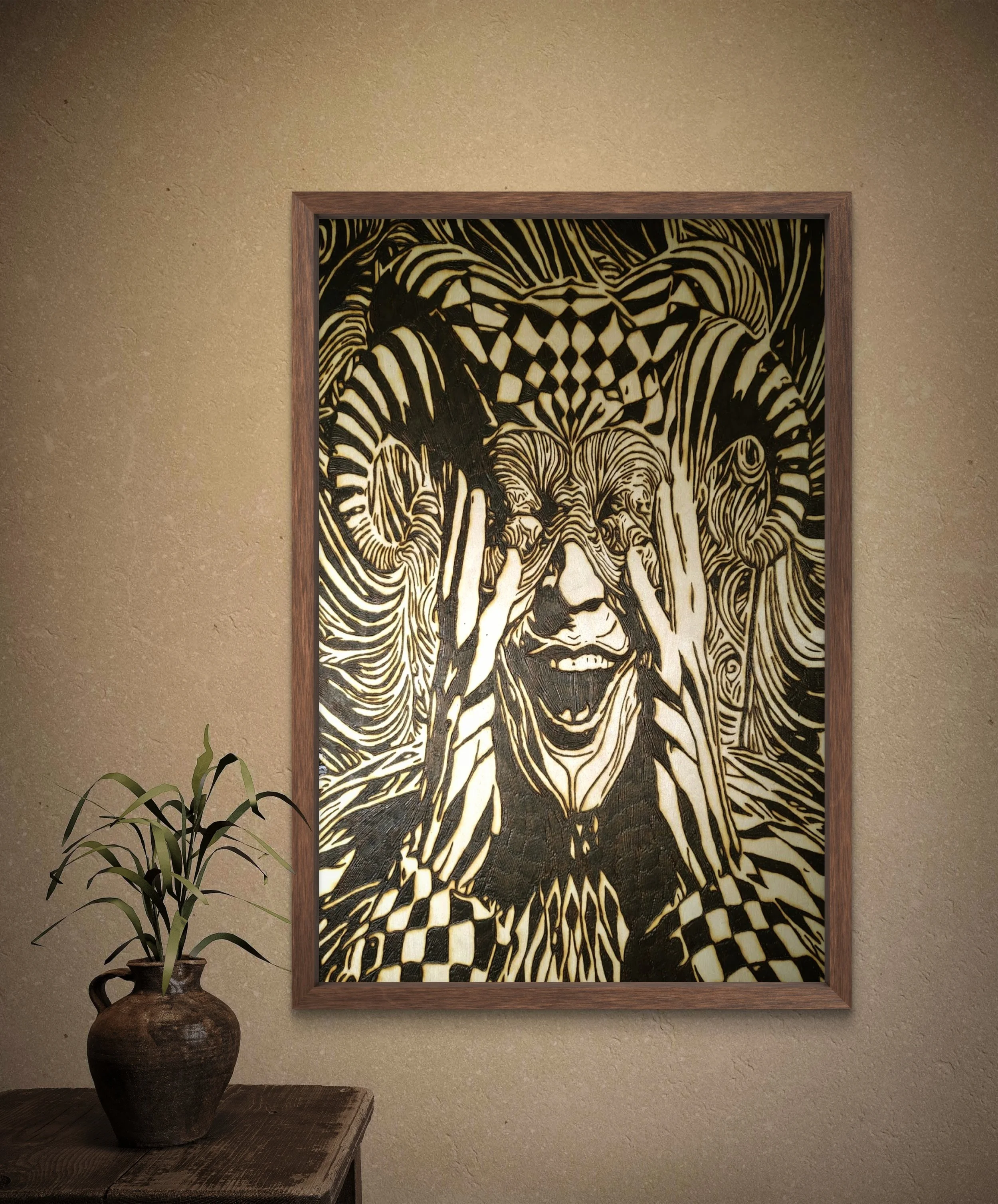 Close-up view of detailed wood-burned wall art featuring warped facial features and layered eye imagery on basswood