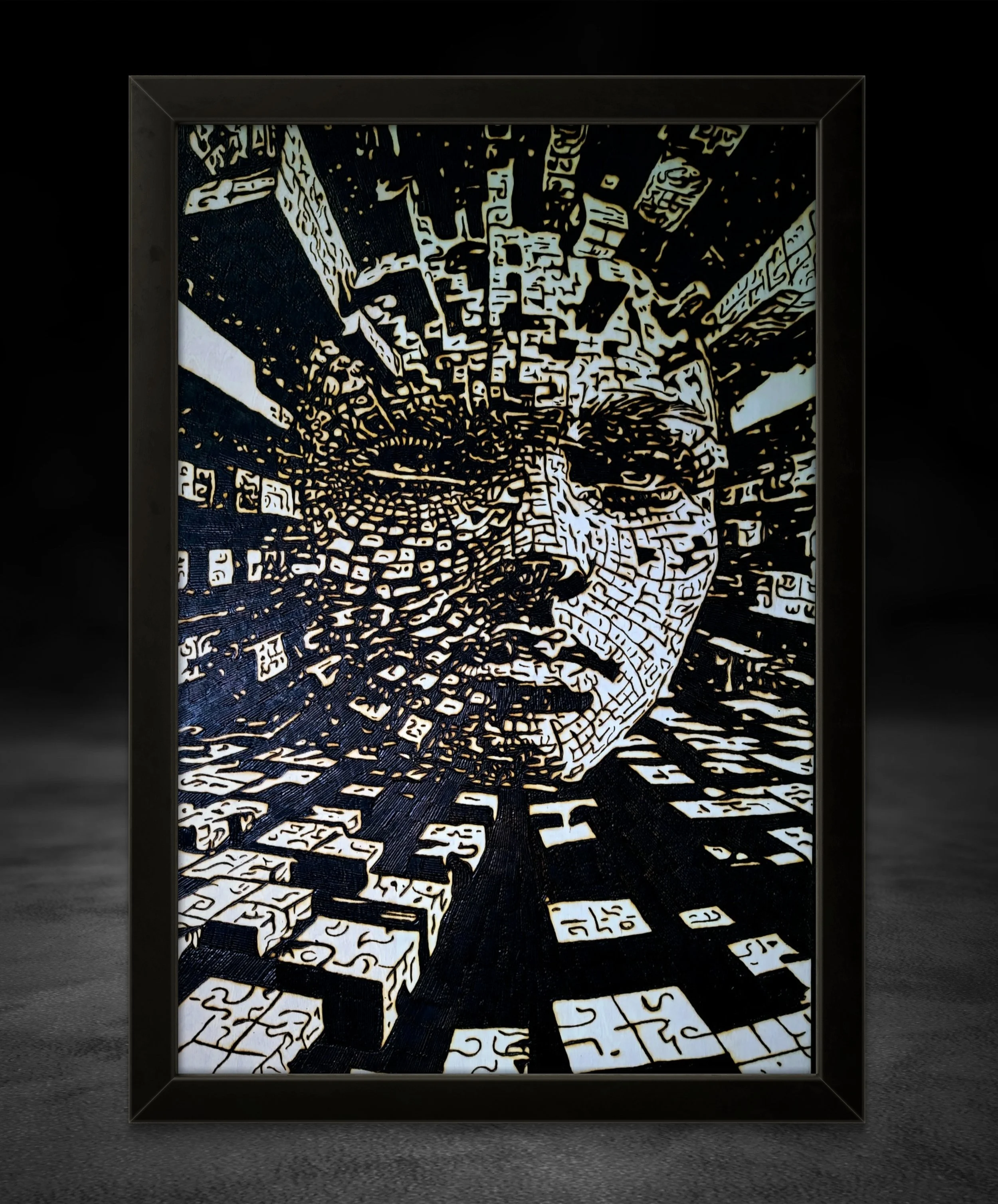 Hand-burned wood artwork depicting a fragmented human face emerging from geometric patterns, burned into basswood with high-contrast detail