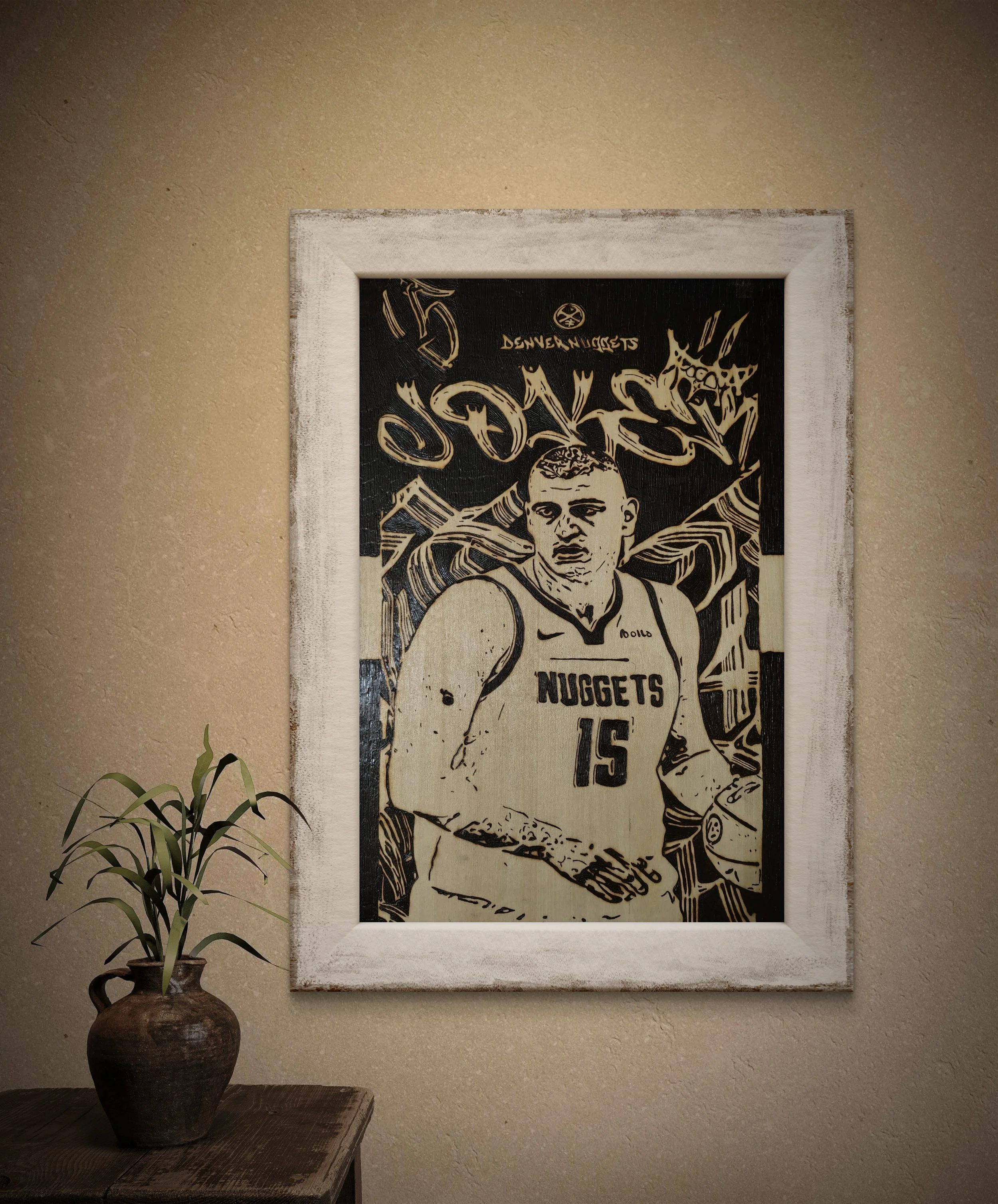 Hand-burned Nikola Jokić wood burning and pyrography wall art displayed in a modern interior setting, showcasing an original basswood sports portrait in a framed presentation