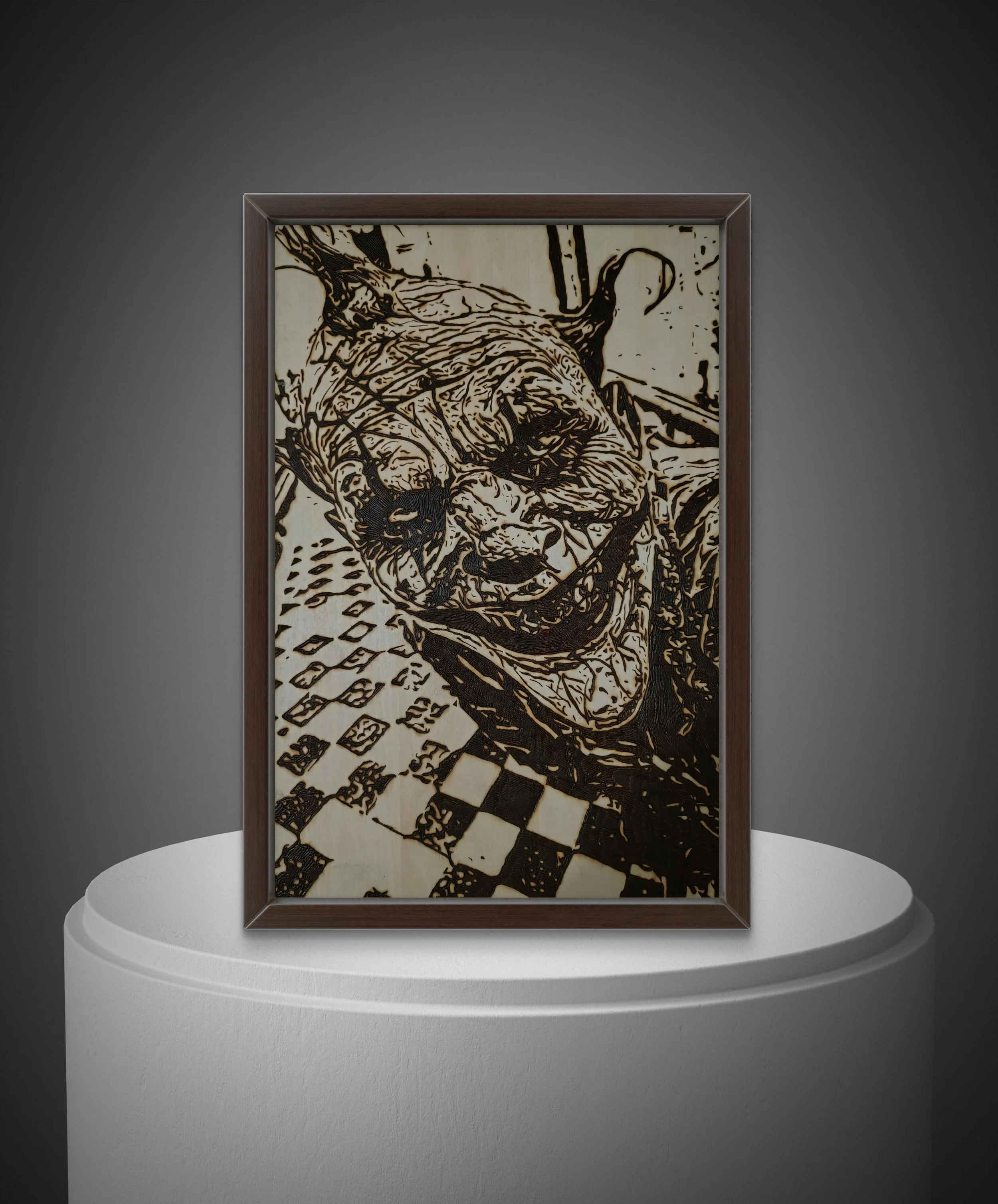 Hand-burned wood artwork depicting a grinning trickster figure with distorted features, burned into natural basswood