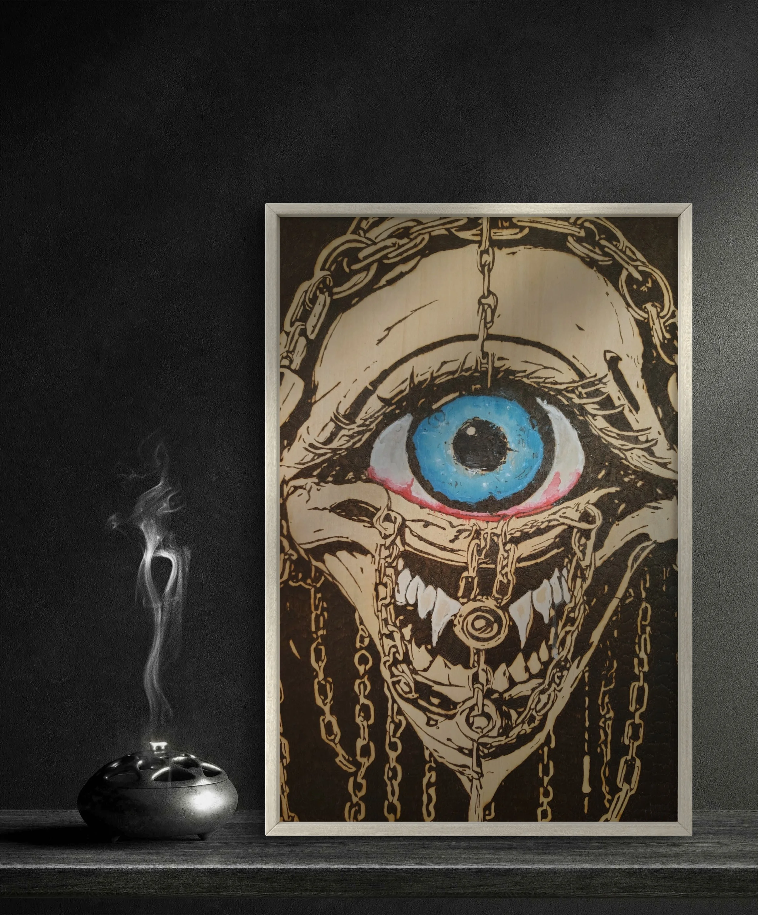 Custom pyrography and wood burning artwork showing a trapped eye bound by chains, enhanced with hand-applied paint on basswood for dramatic contrast