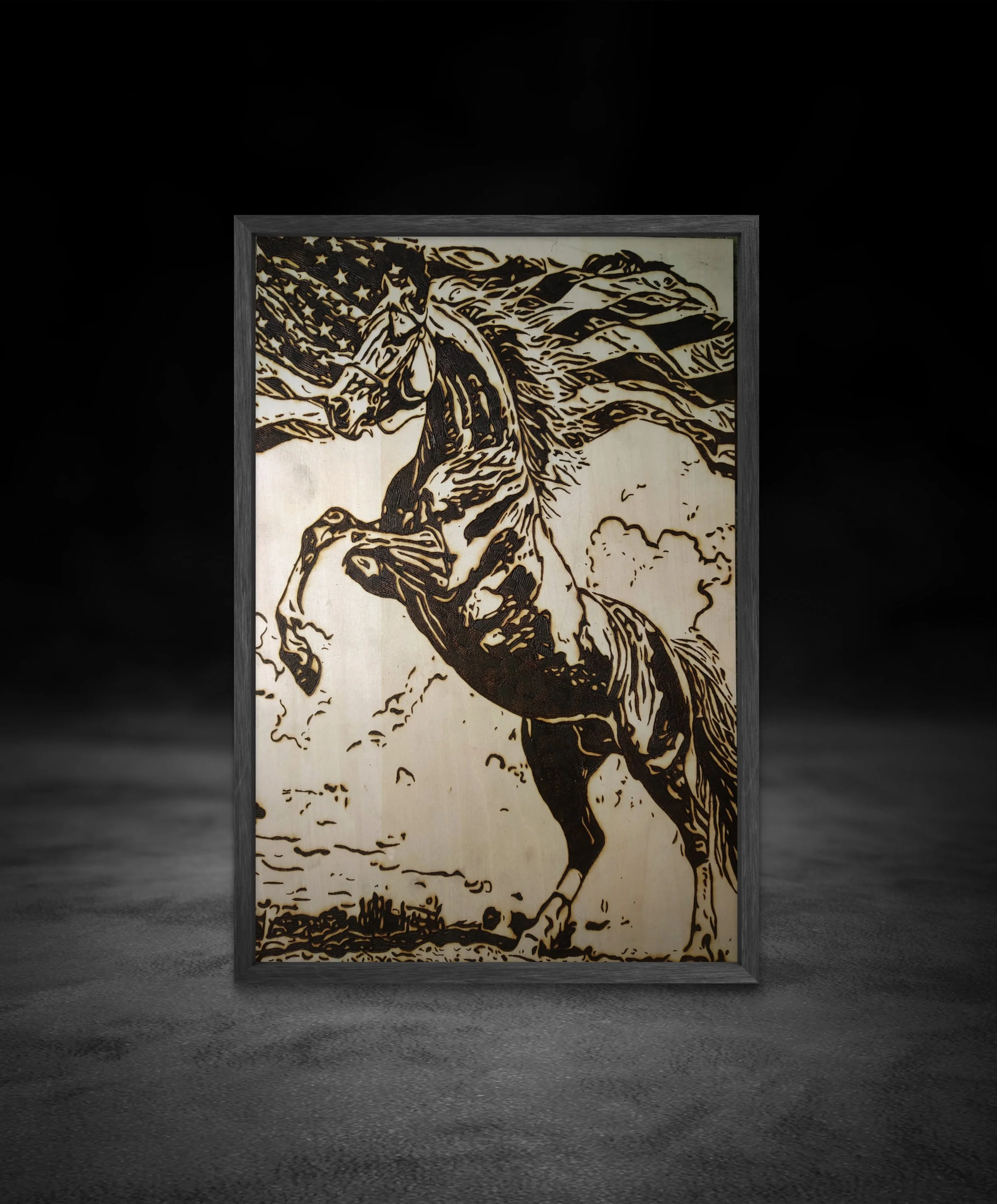 Handcrafted wood-burned artwork depicting a rearing horse intertwined with flowing American flag imagery, created as original hand-burned pyrography on solid wood.