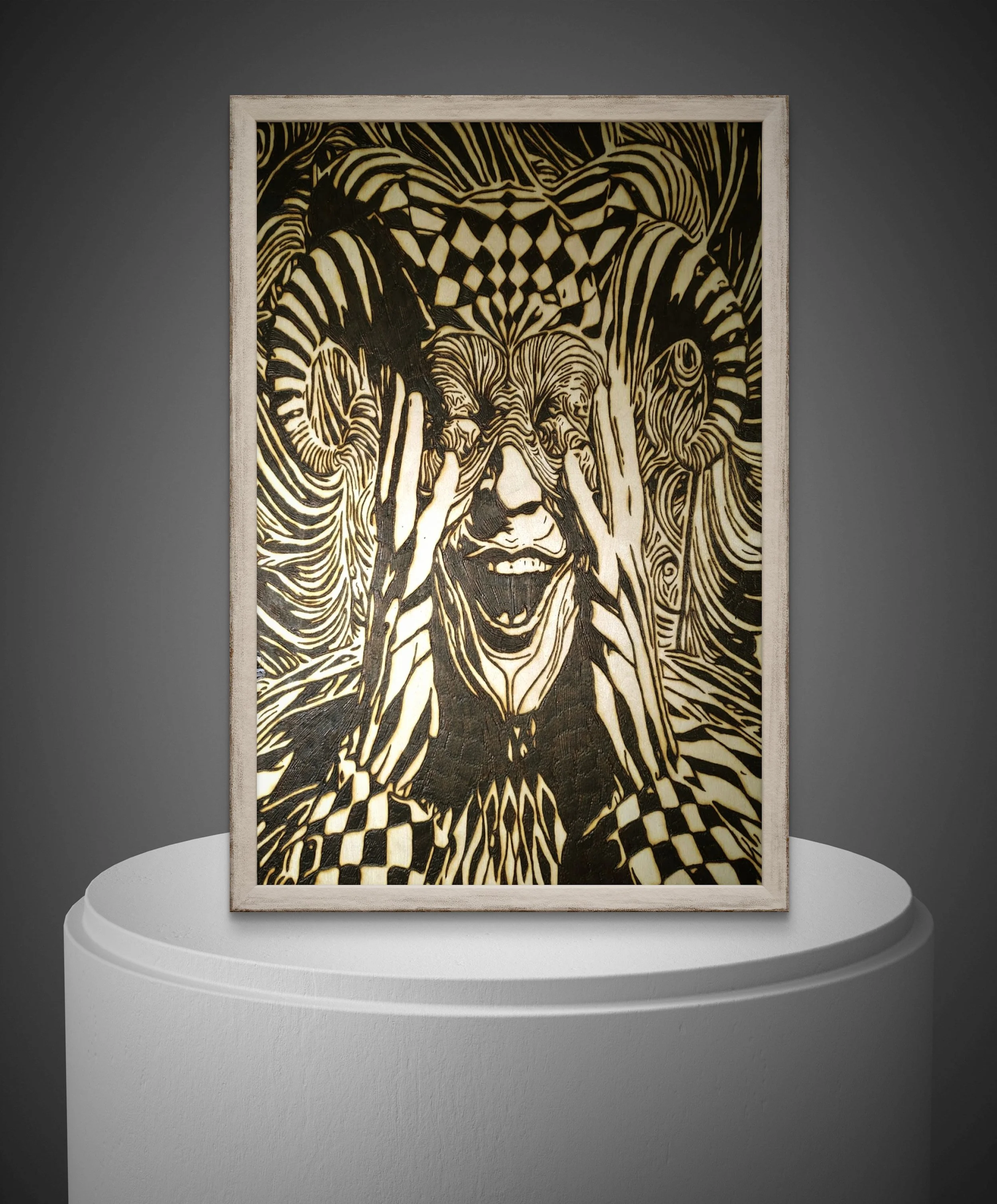 Hand-burned wood art depicting a distorted face with multiple eyes, carved into basswood with intricate line work