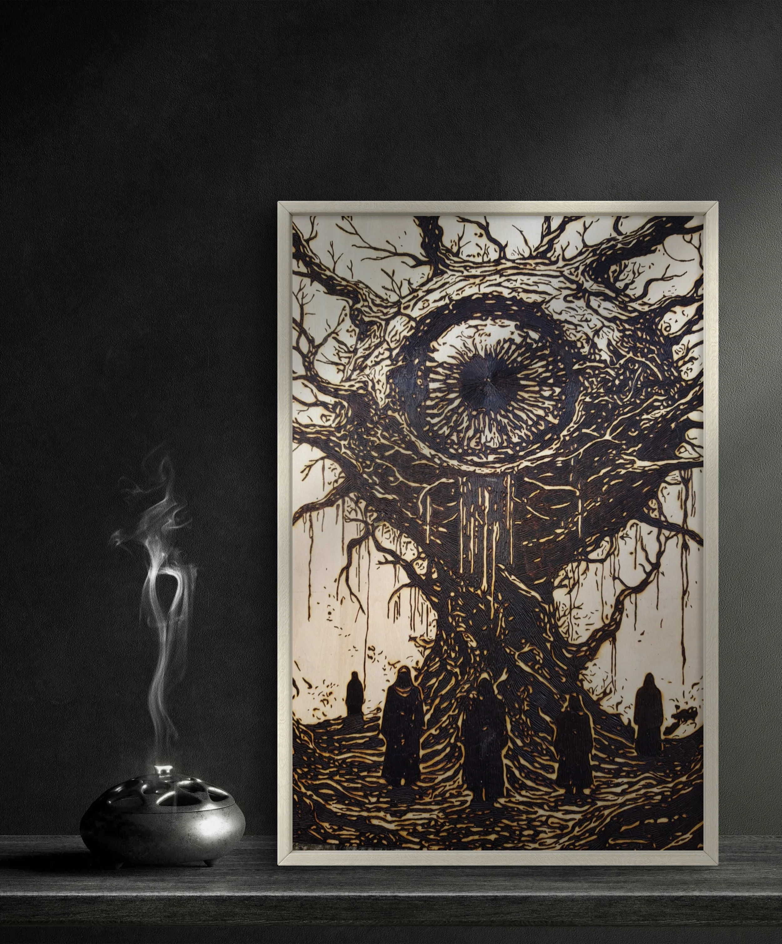 Original dark surreal wood burning pyrography artwork featuring an ominous eye monolith and robed figures, framed and photographed to emphasize depth and texture