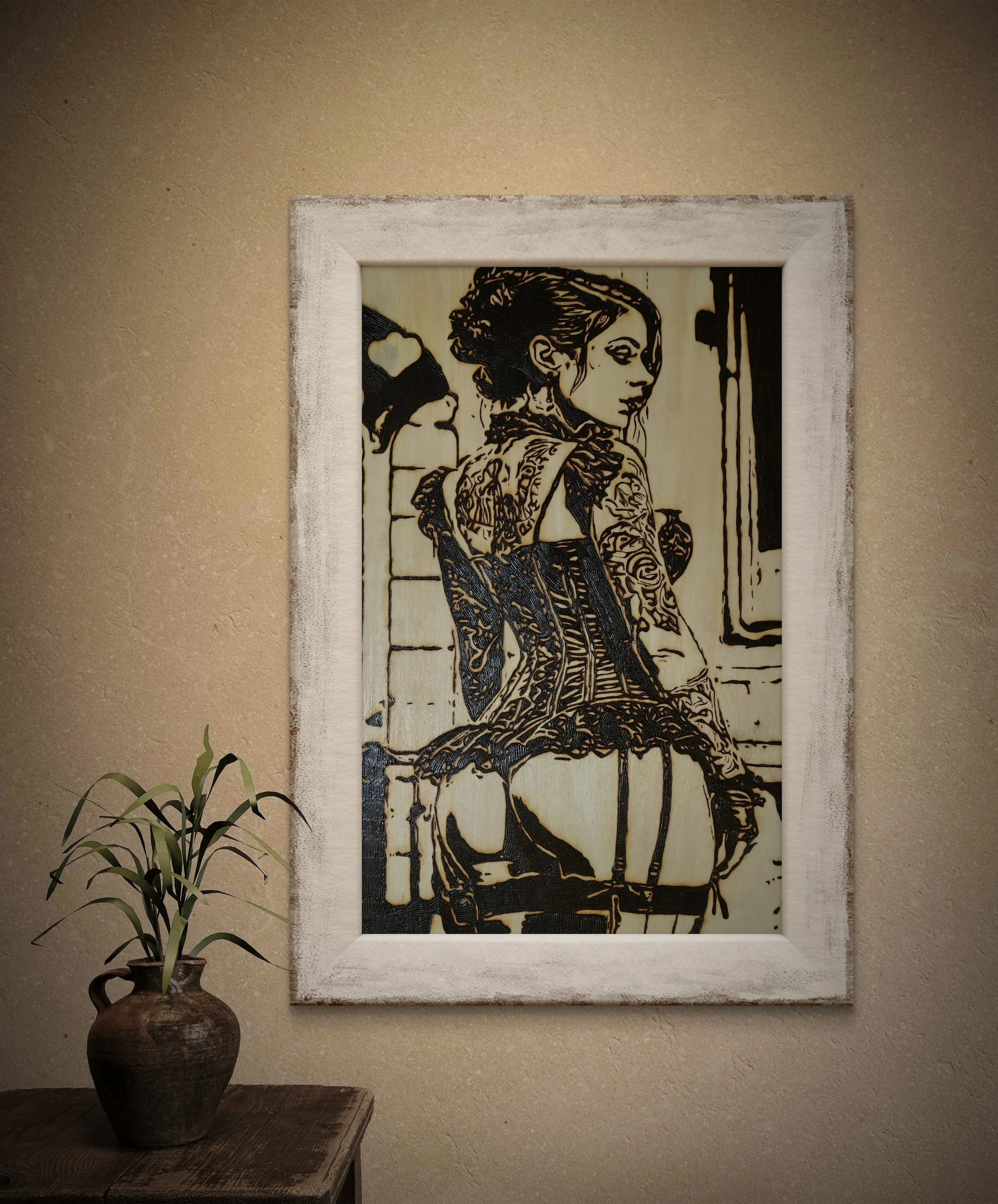 Close-up view of detailed wood burning showing corset, tattoos, and shadowed figure on basswood