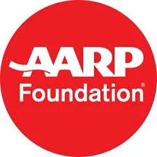 A red circular logo with the white text 'AARP Foundation'