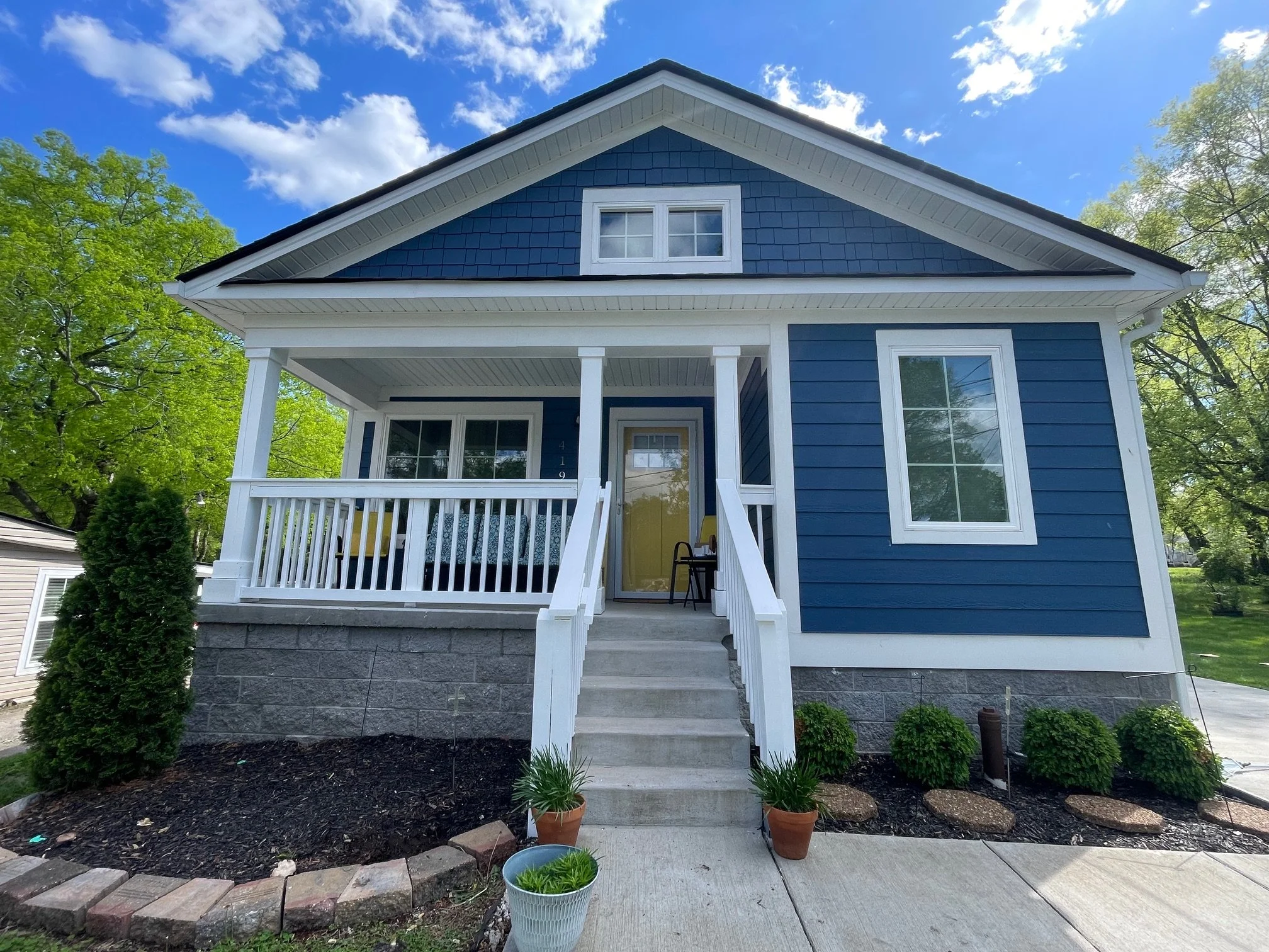 A small blue house that is organized with statewide housing organization