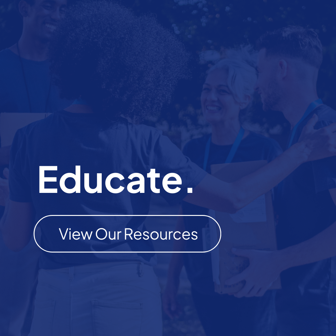 Four people stand together outdoors, two of them holding boxes. Text overlay reads: “Educate. View Our Resources.” for housing advocacy in Tennessee.