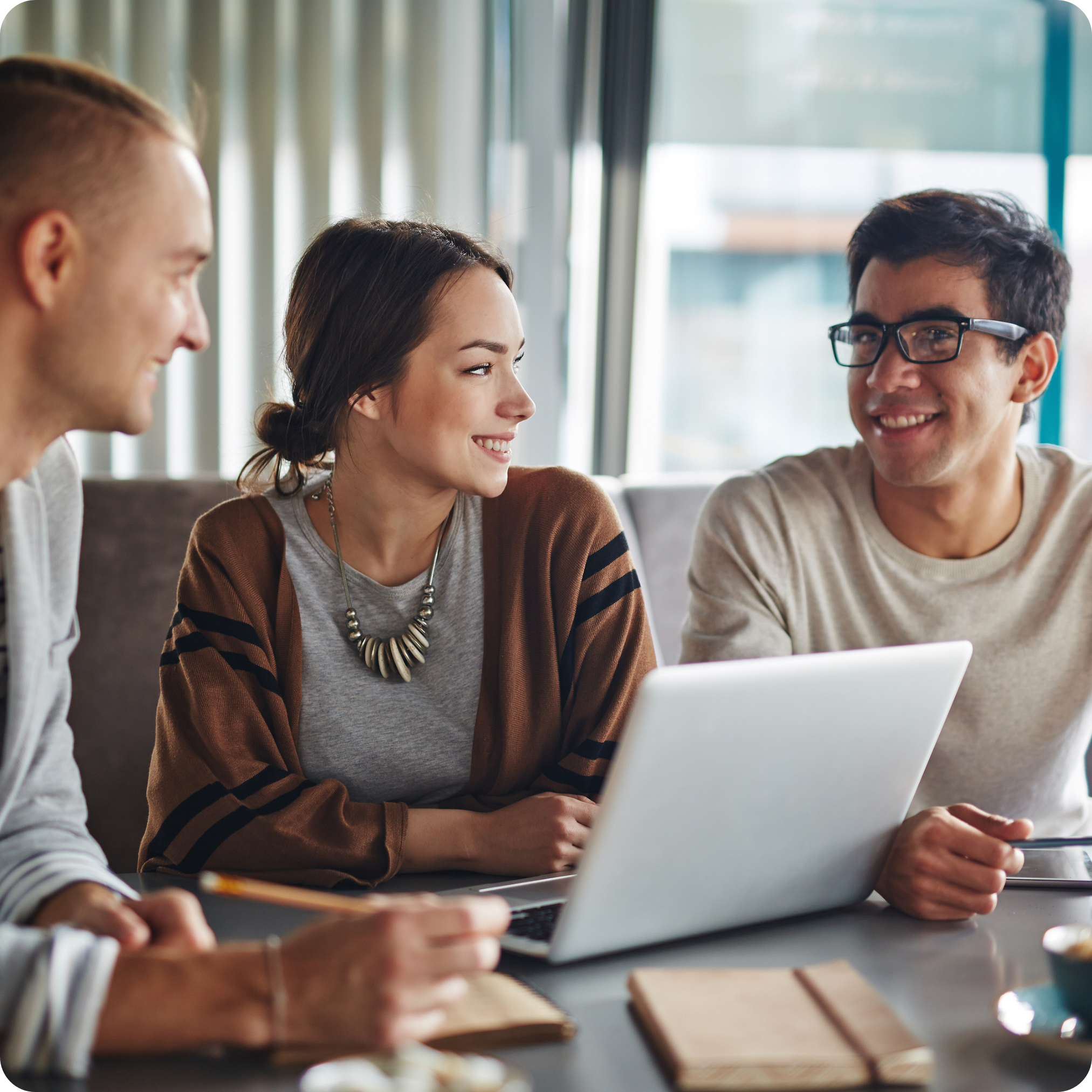 A group of three people discussing affordable housing network.