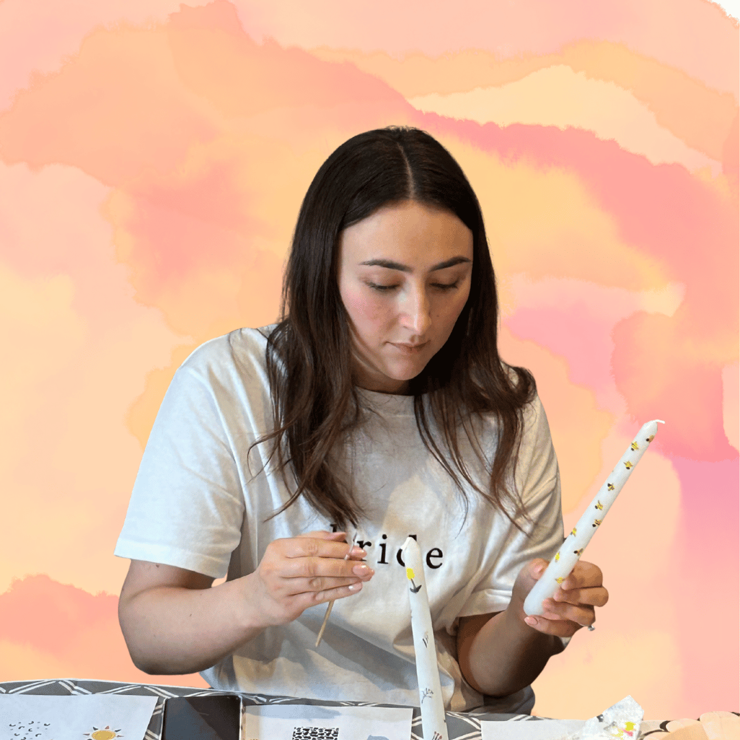 bride painting candles at her hen party i