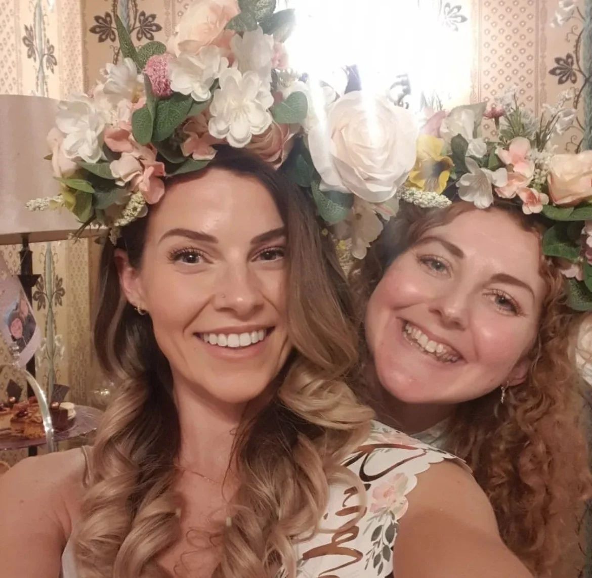 bride and bridesmaid wearing their faux flower crowns