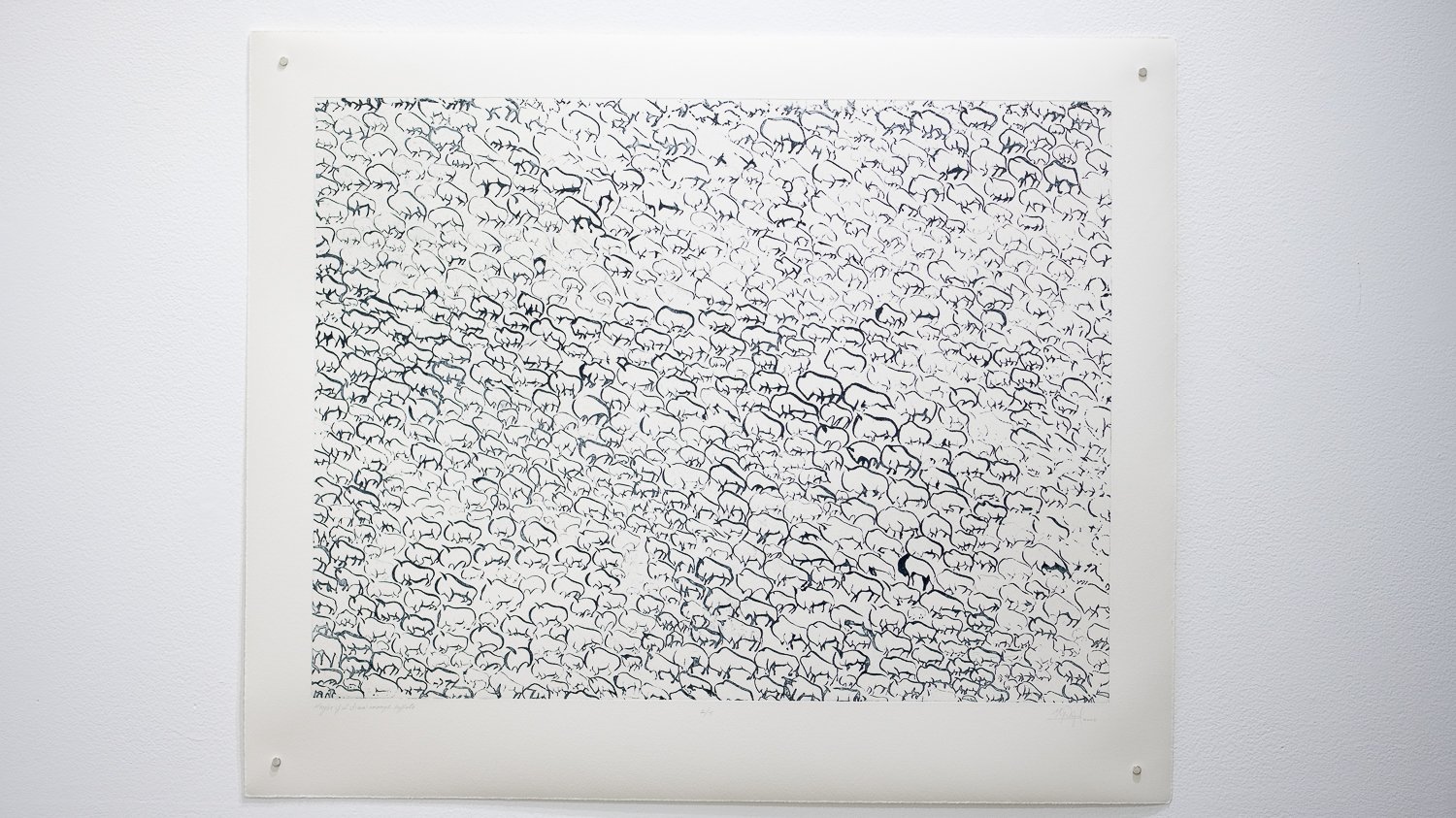 Art piece featuring numerous stylized black and white elephants densely packed together.